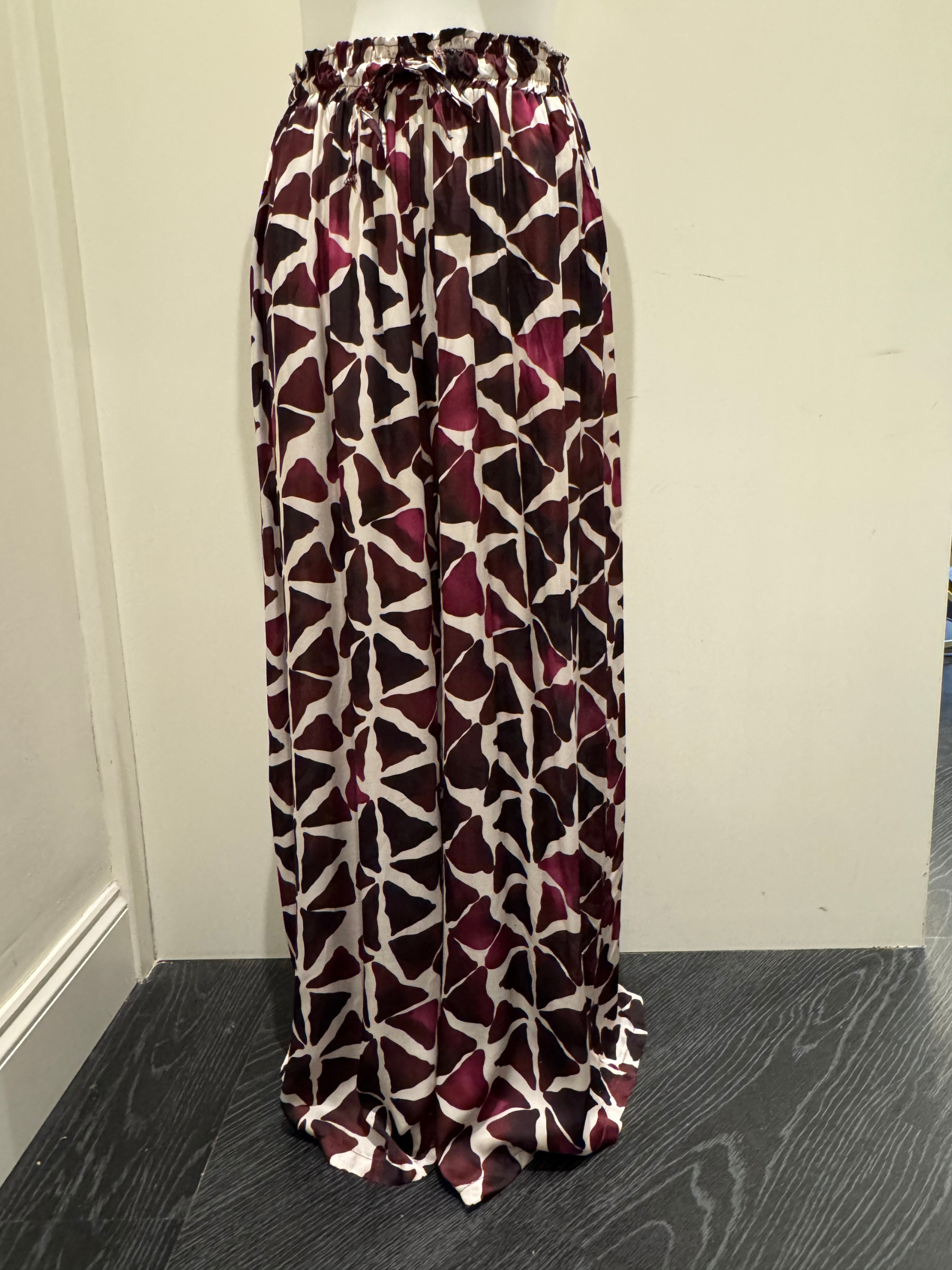 Deck by Decollage wide-leg trousers with an abstract berry and ivory print, featuring an elasticated waistband and fluid silhouette-designed for bold, stylish comfort.