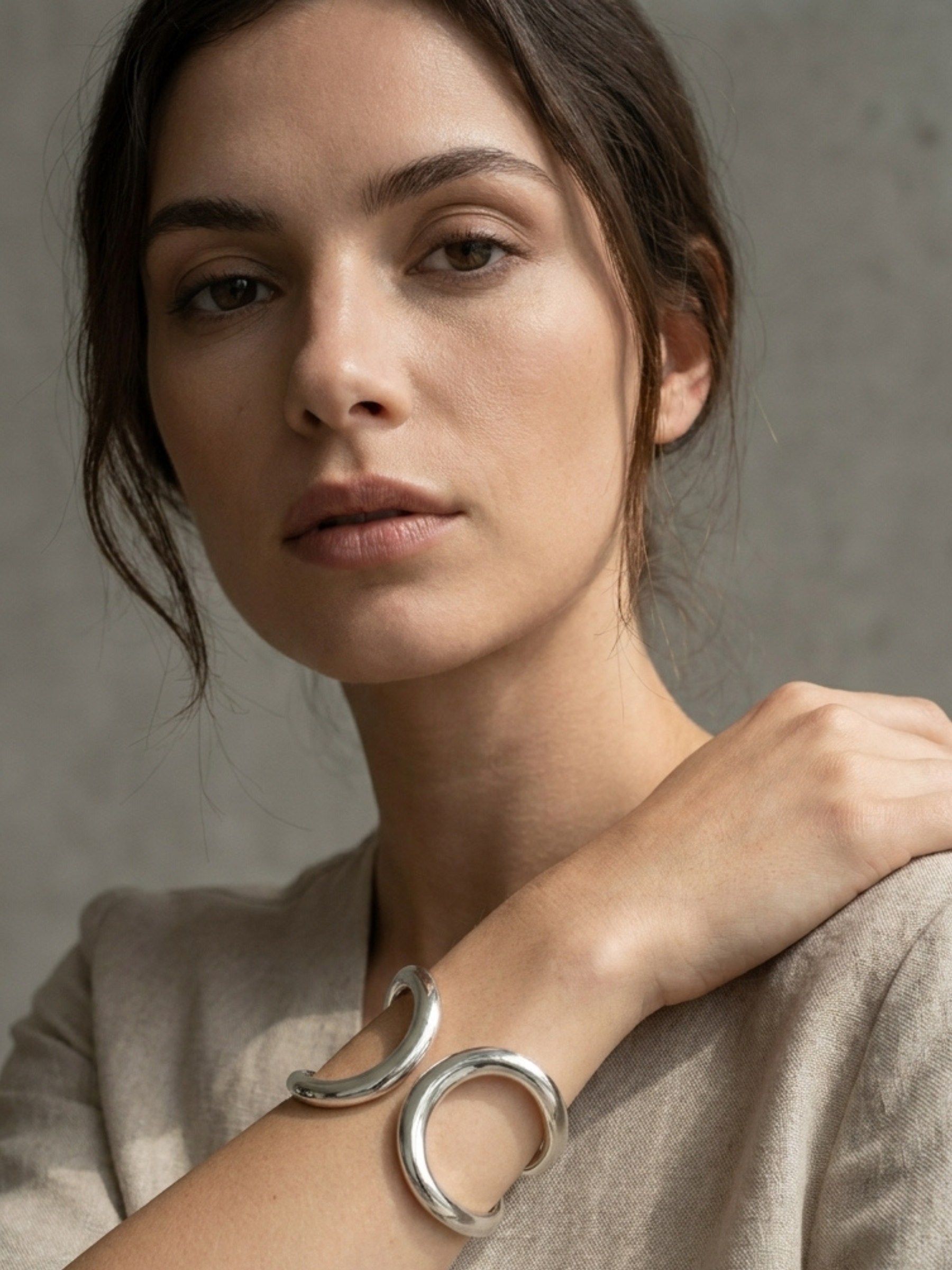 Envy 4707 Double Looped Hinged Bangle Bracelet with sculptural double-loop design and smooth polished finish.