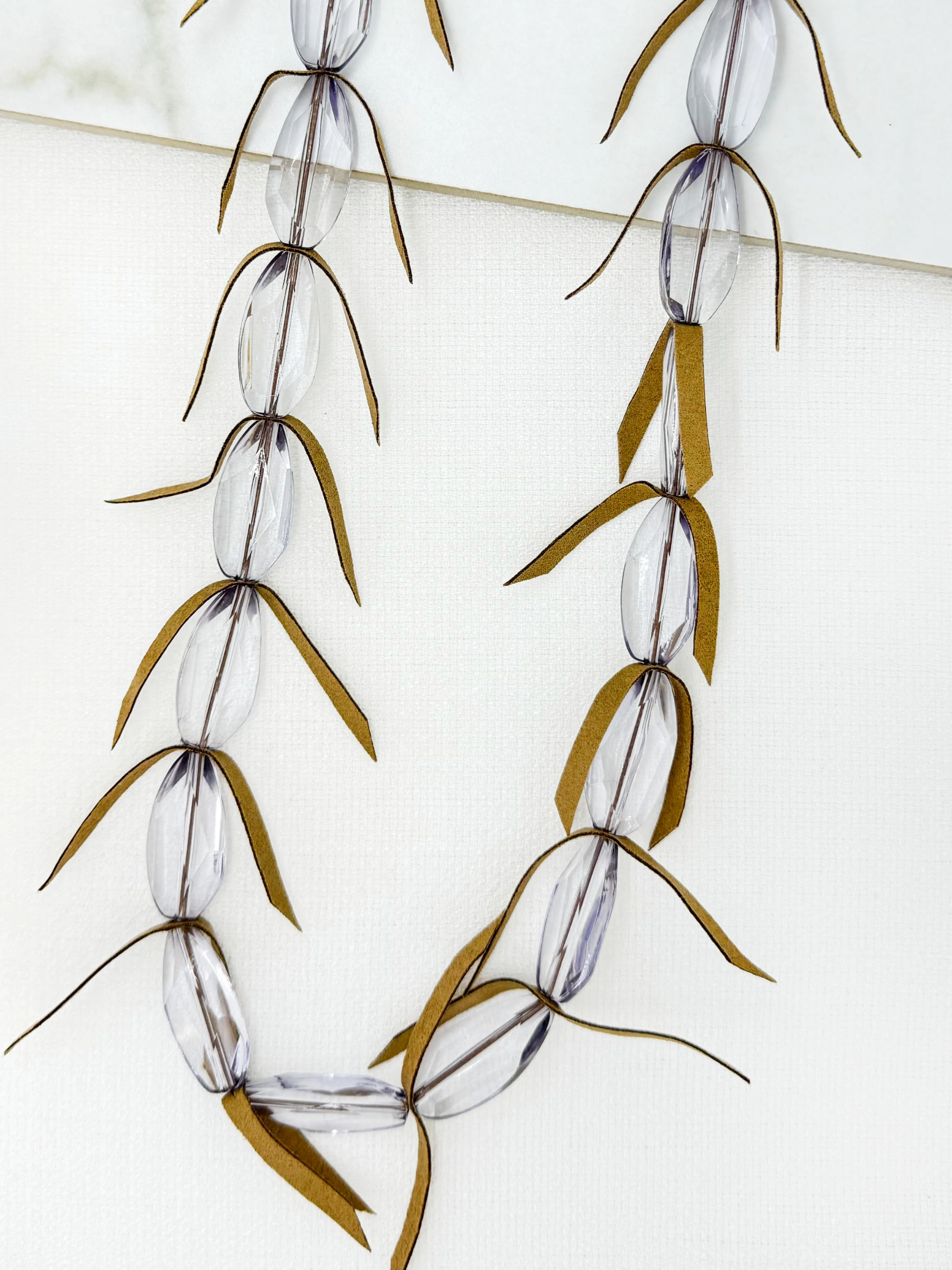 Envy 4743 Frosted Beaded Feathered Necklace with elongated frosted beads and feather-inspired accents.