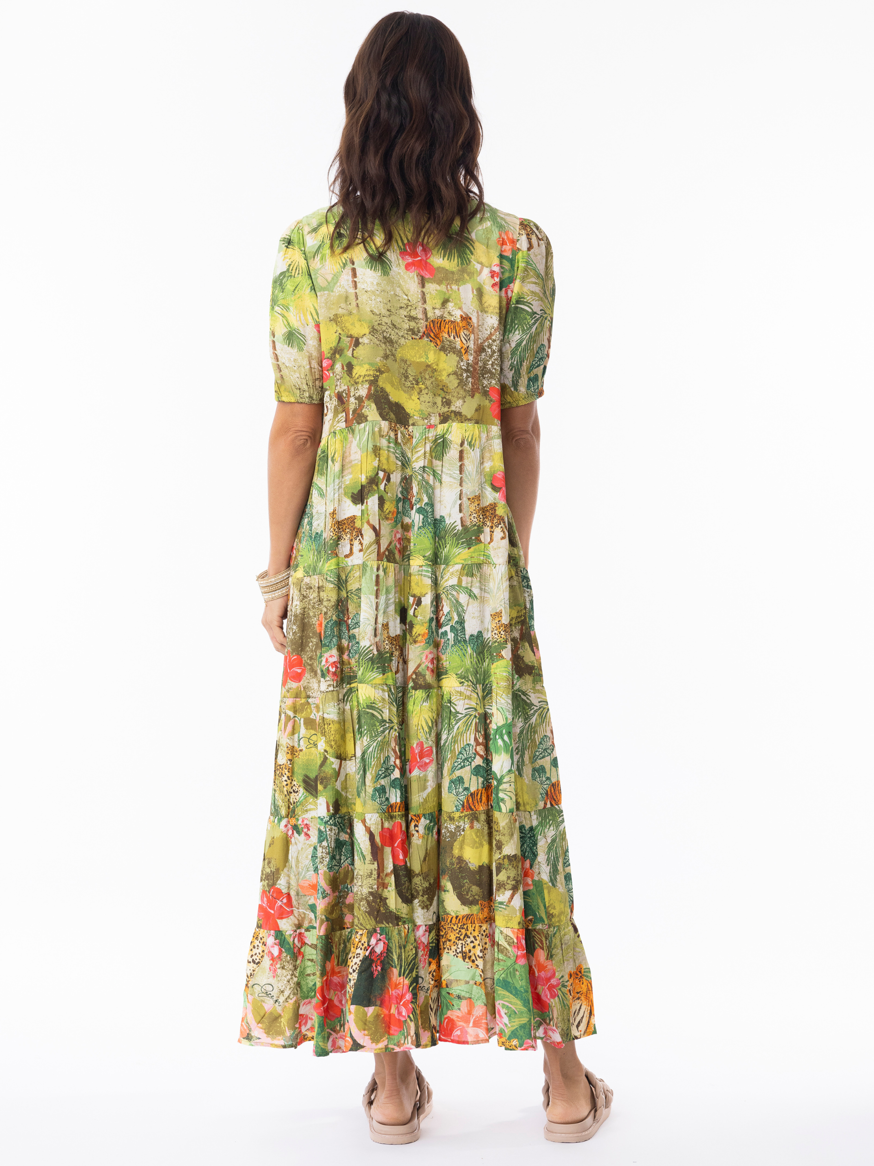 Escape 10049 Cecilia Maxi Dress with V-neckline, tiered A-line silhouette, three-quarter sleeves and full-length flowing skirt in vibrant jungle-inspired print.