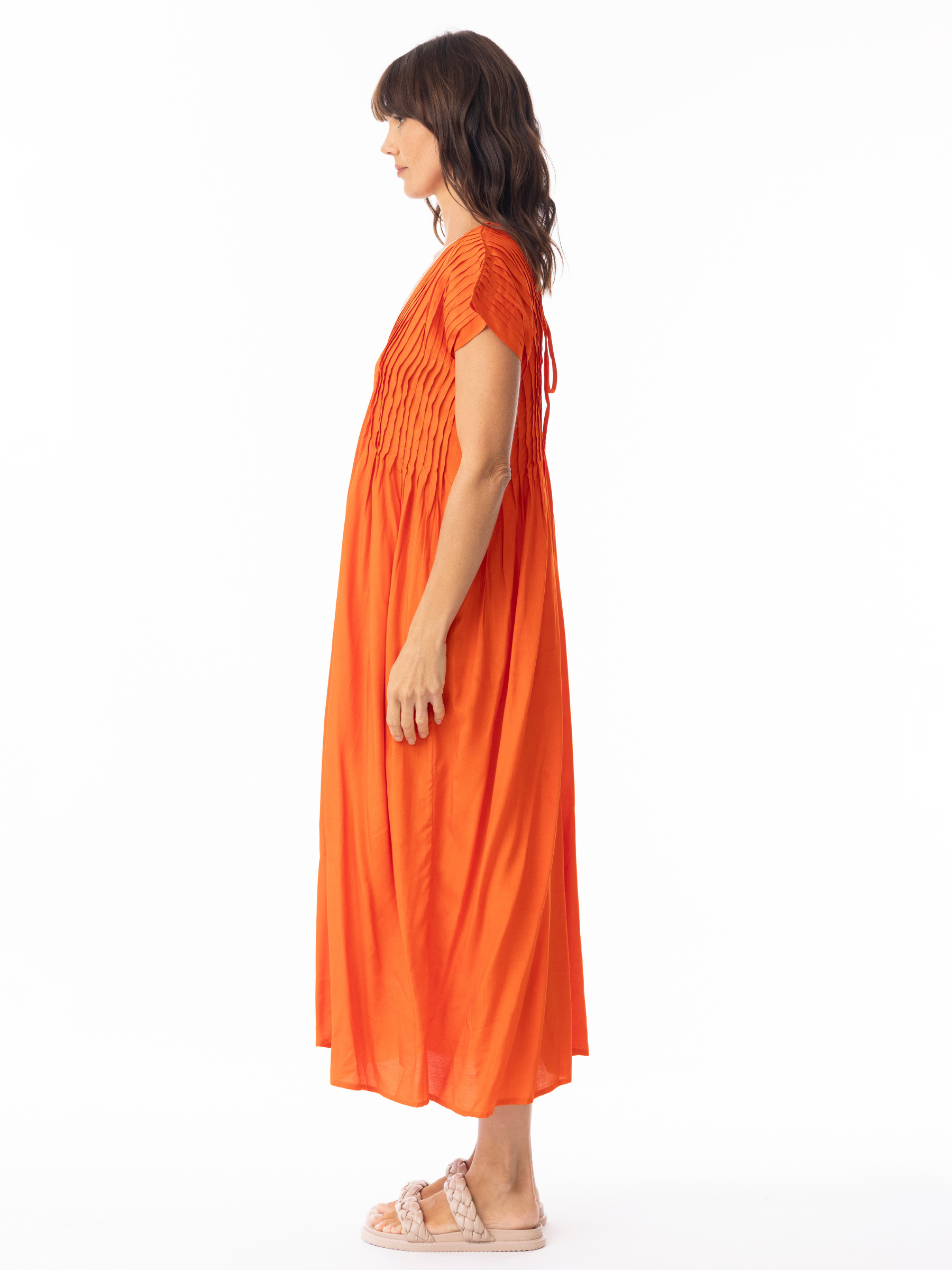 Escape 51903 Lux Pleated Mandarin Dress with mandarin neckline, pleated bodice detailing, cap sleeves and relaxed flowing midi silhouette.