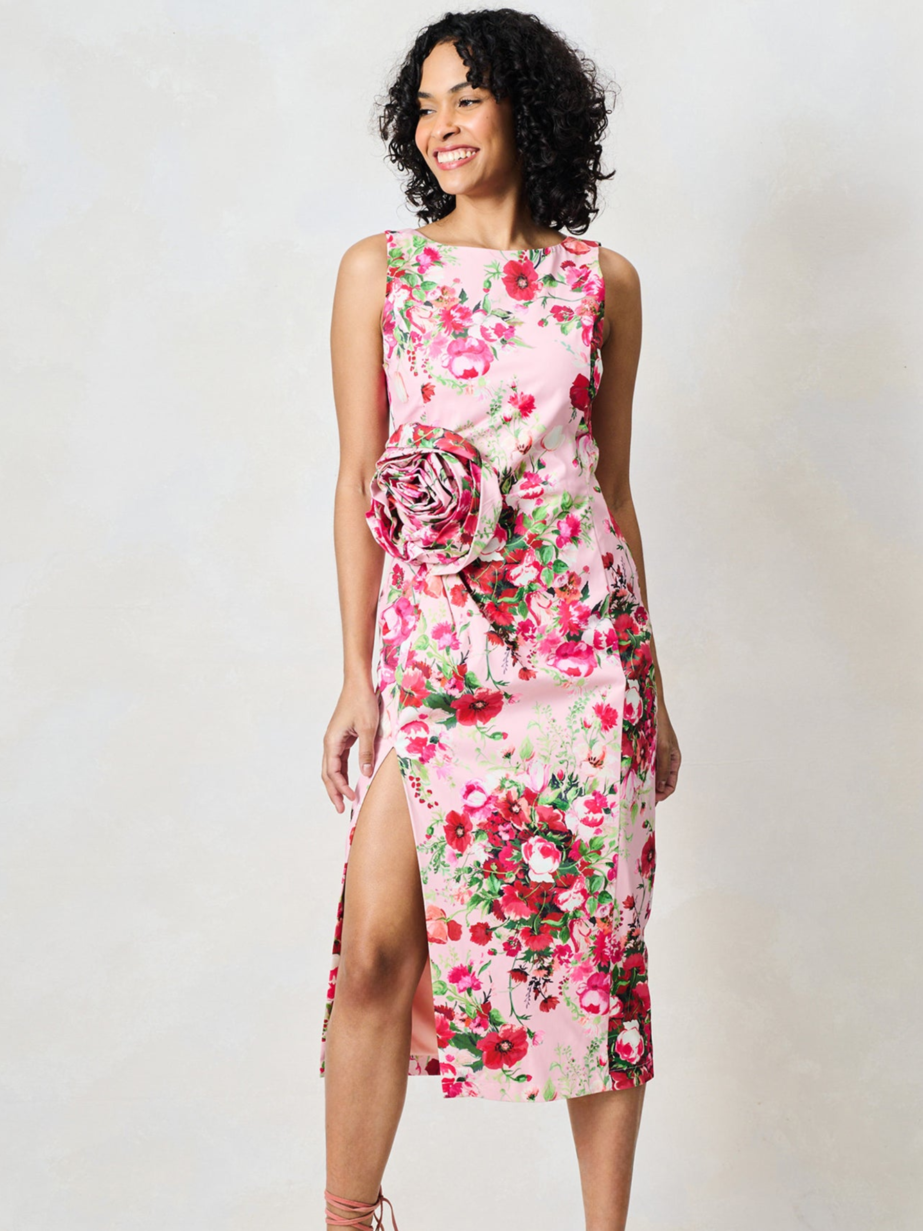 Hope & Ivy Megan Pink Floral Dress with round neckline, sleeveless design, floral waist detail and fitted pencil silhouette with thigh split.