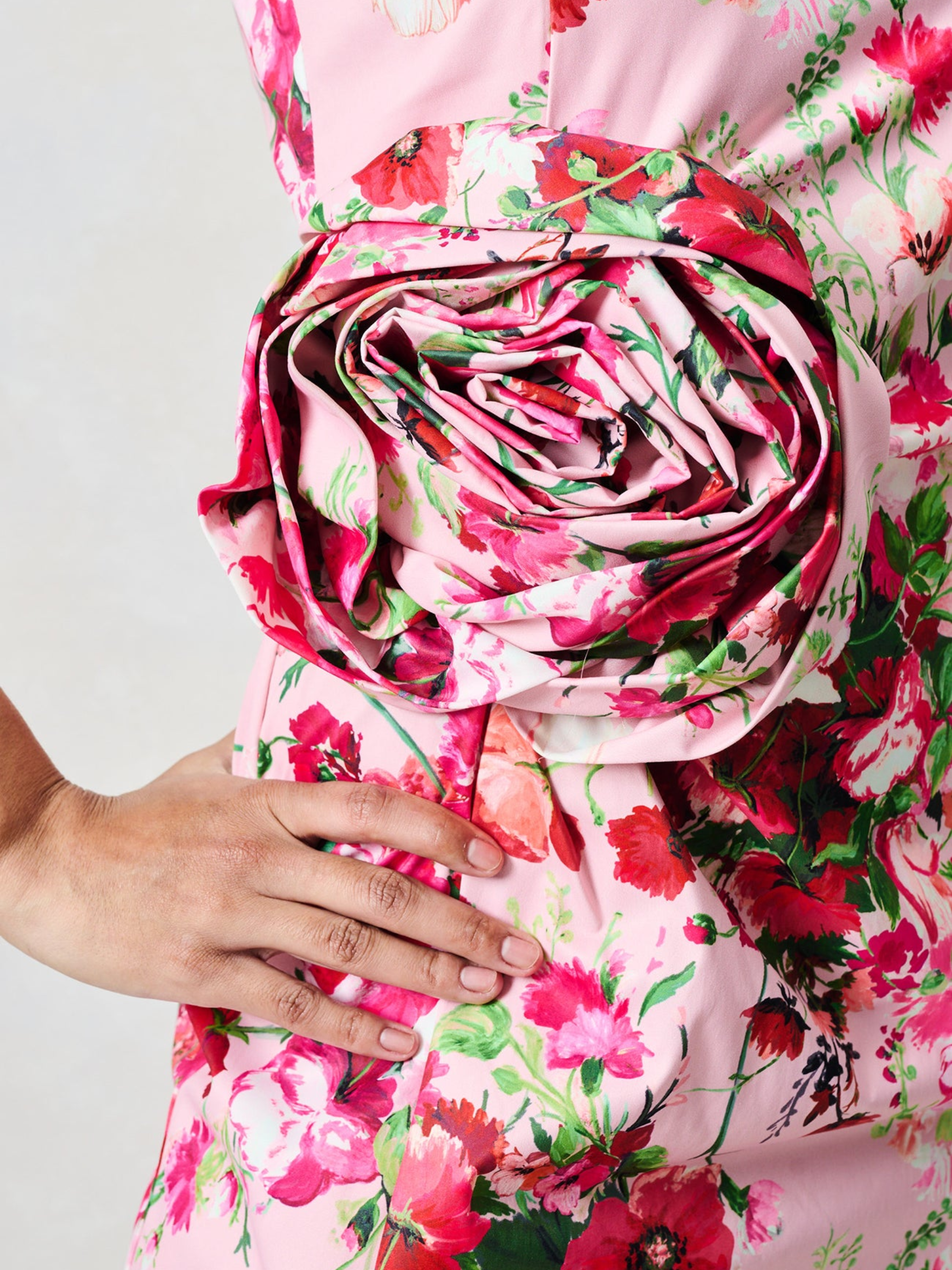 Hope & Ivy Megan Pink Floral Dress with round neckline, sleeveless design, floral waist detail and fitted pencil silhouette with thigh split.