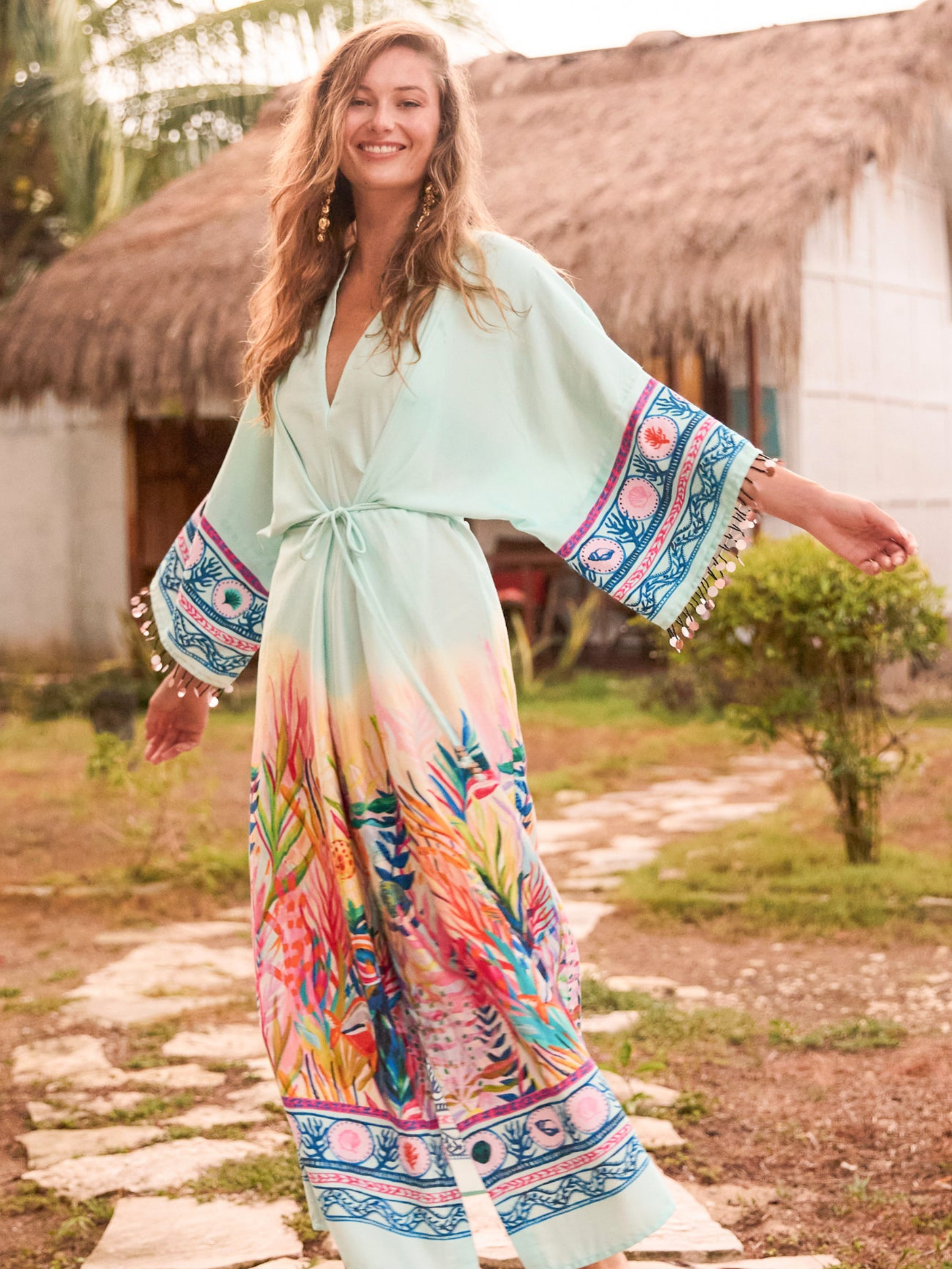 Hope & Ivy Nora Blue Kimono Sleeve Adjustable Tie Waist Midi Dress – women’s blue underwater print dress with beaded sleeves, tie waist and front split. Perfect for summer occasions and holidays.