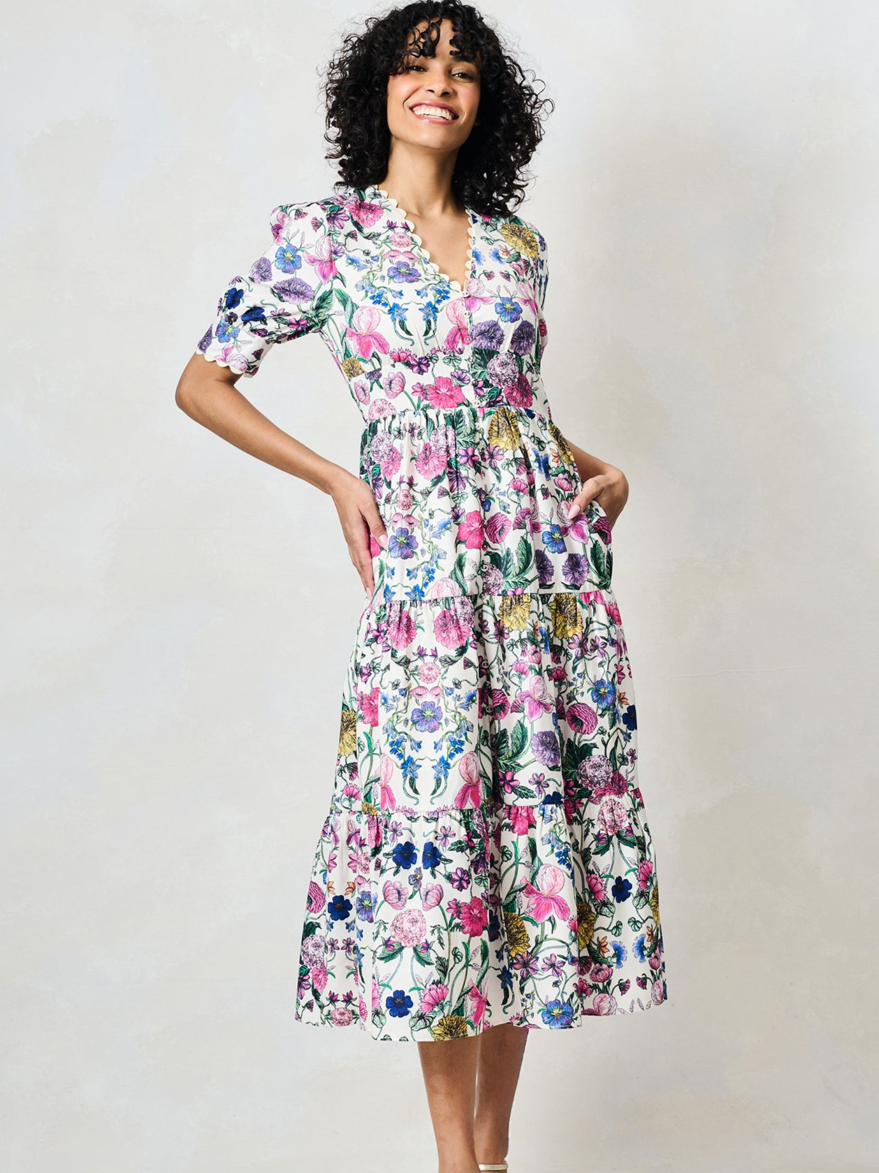 Hope & Ivy Sonnet White Floral Dress with V neckline, puff sleeves, fitted waist and flowing midi skirt.
