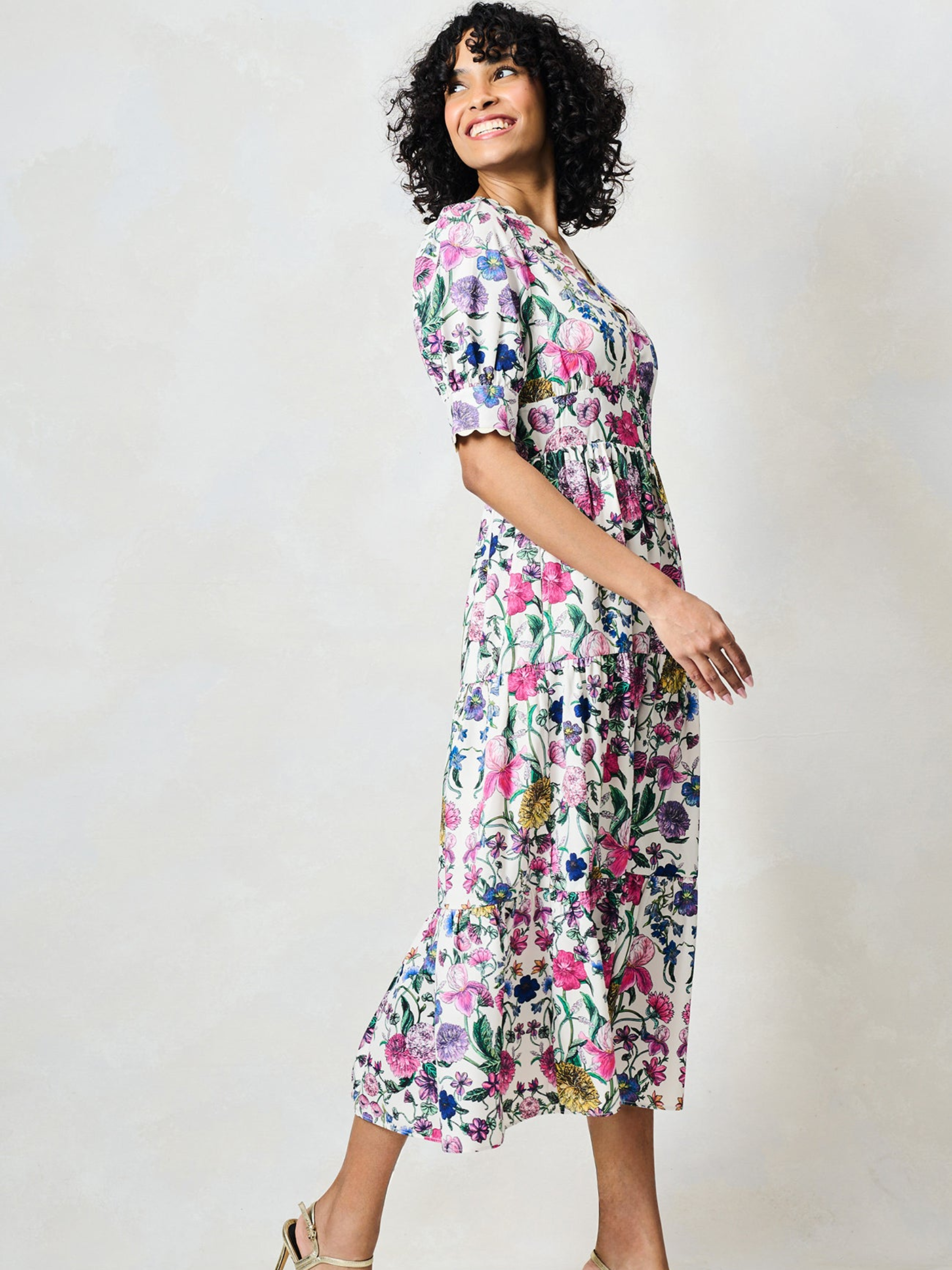 Hope & Ivy Sonnet White Floral Dress with V neckline, puff sleeves, fitted waist and flowing midi skirt.