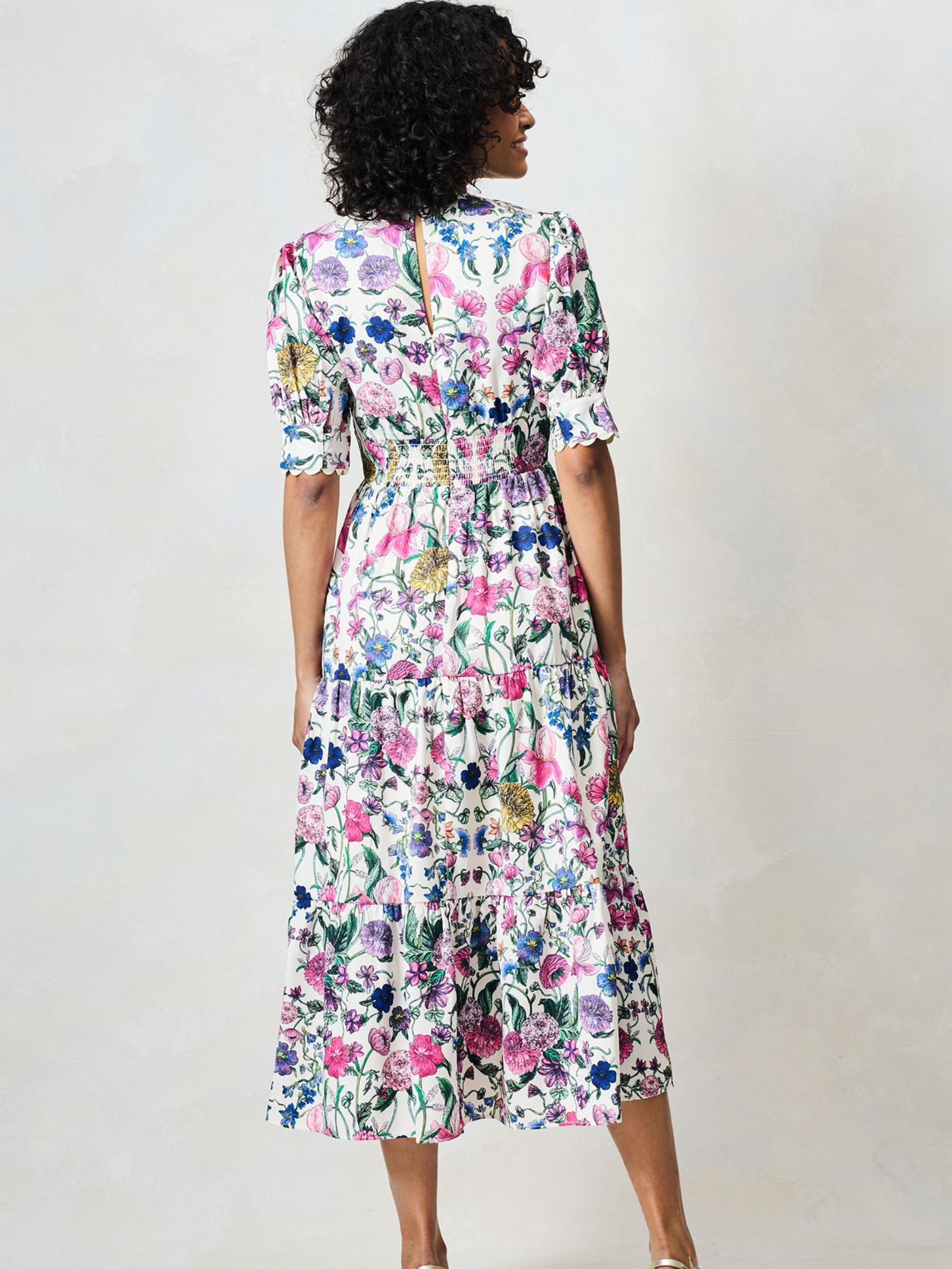 Hope & Ivy Sonnet White Floral Dress with V neckline, puff sleeves, fitted waist and flowing midi skirt.