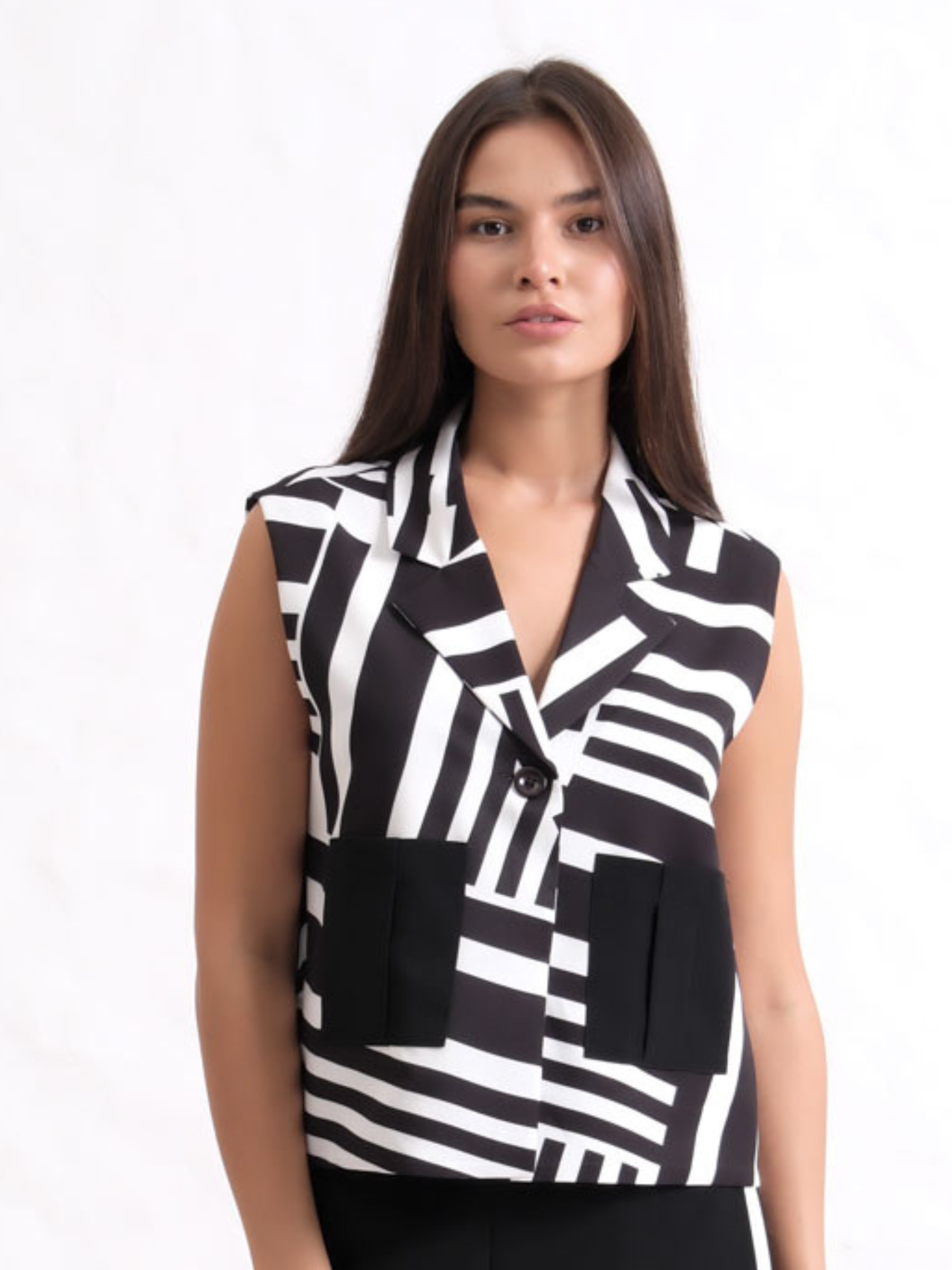 Inco 1219 sleeveless waistcoat with monochrome print, lapel collar and contrasting front pockets.