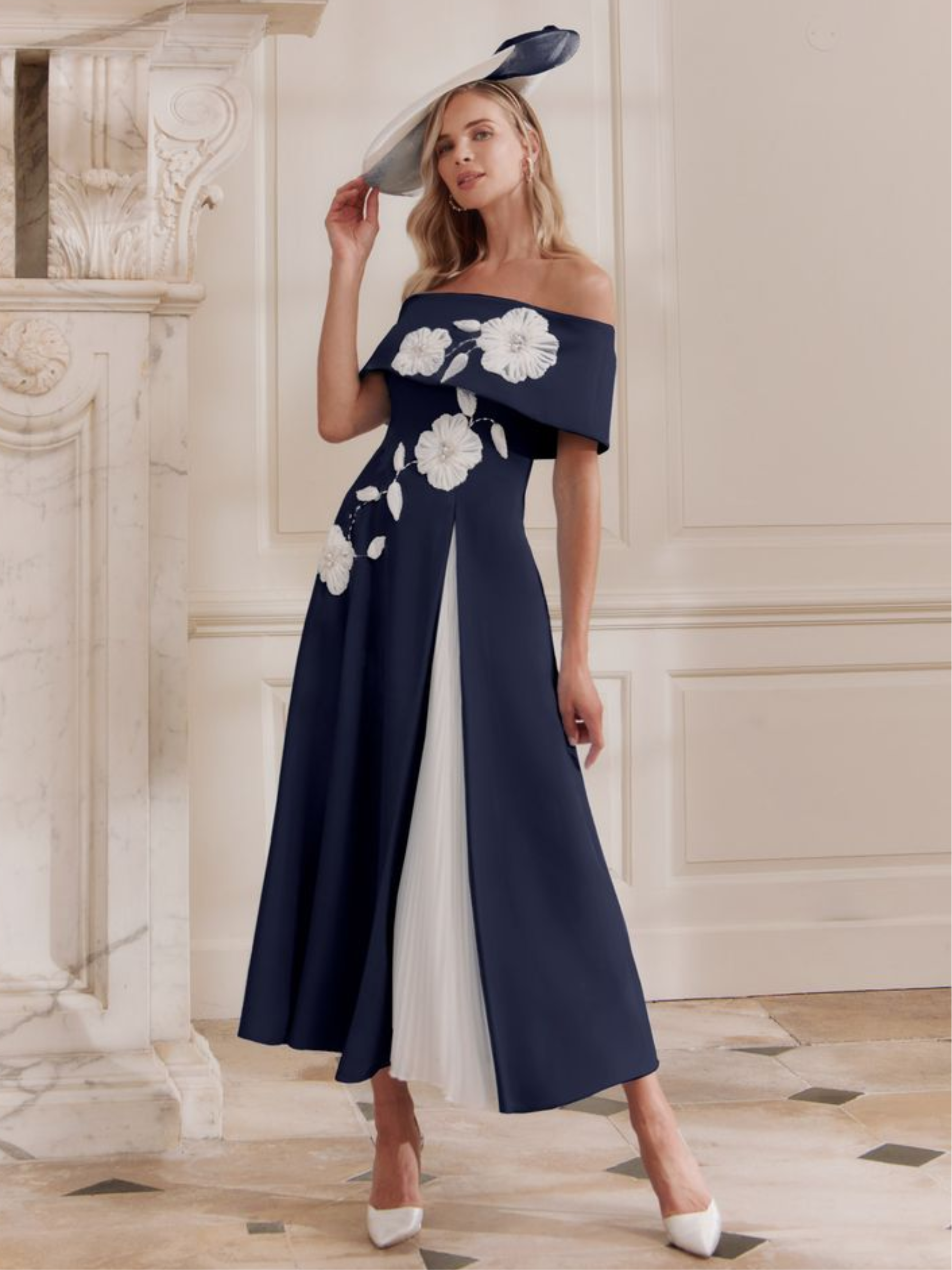 John Charles 29358 Navy/Ivory Dress with bardot neckline, A-line midi silhouette, plissé chiffon godet and contrast floral appliqué.