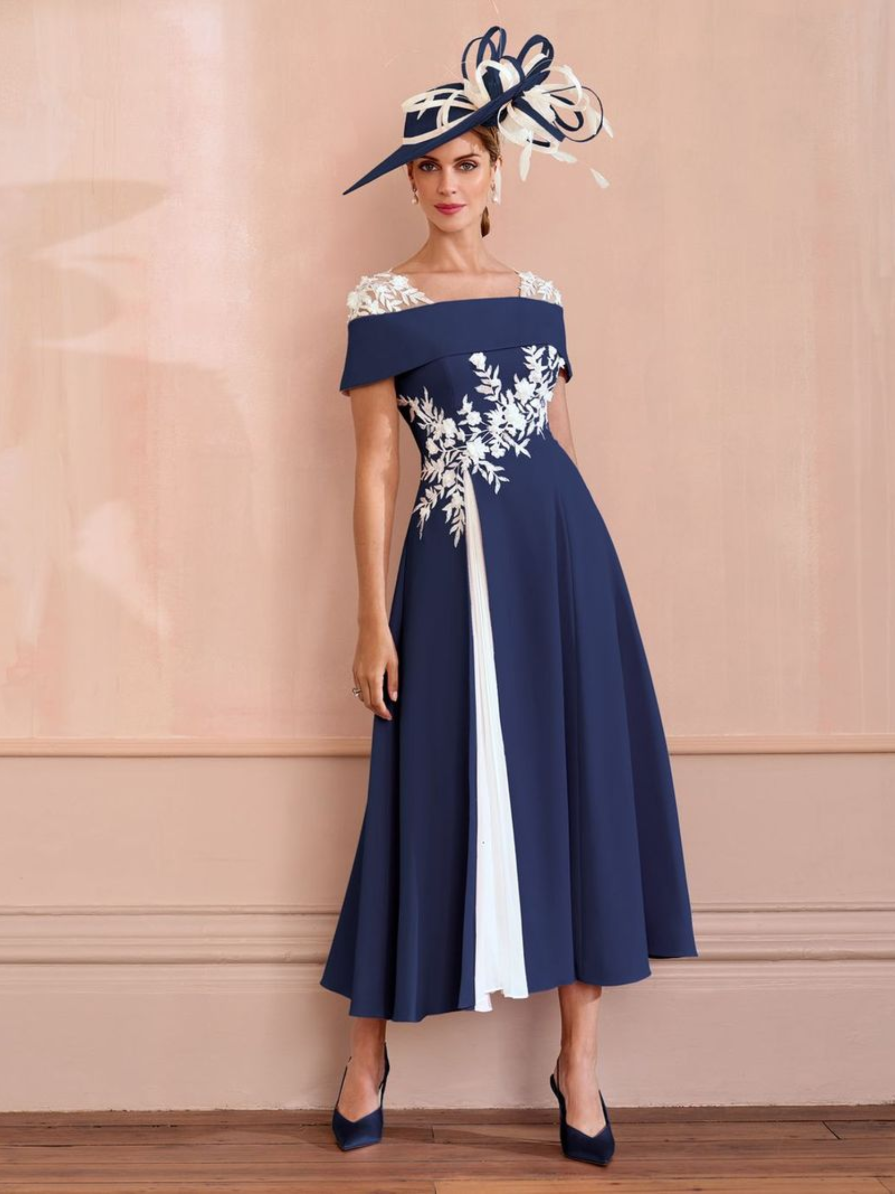John Charles 66625 Navy/Ivory Dress with bardot neckline, A-line silhouette, plissé chiffon godet and ivory appliqué detailing.