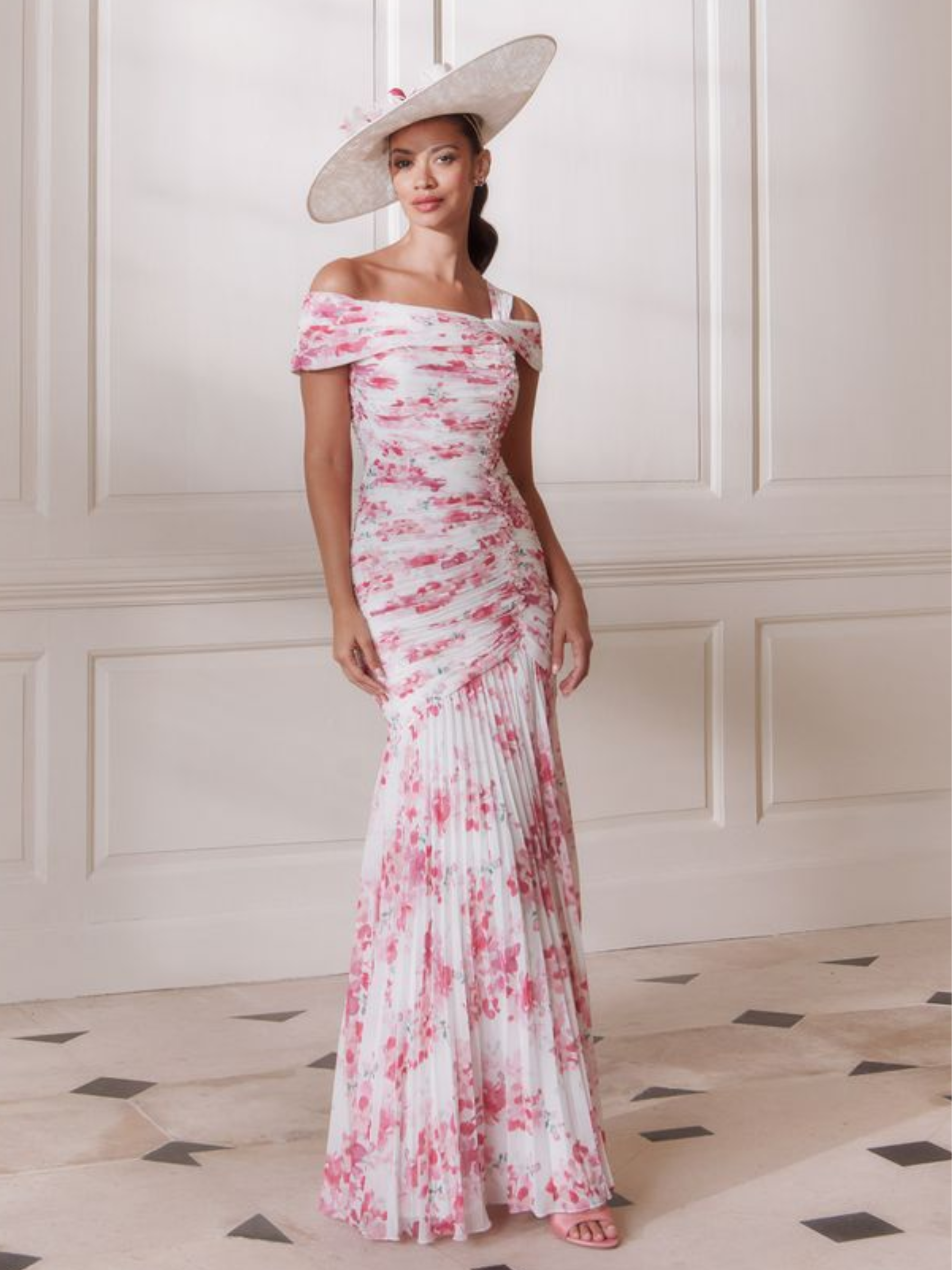 John Charles 66727A Pink Blossom Dress with off-the-shoulder wrap neckline, ruched bodice and pleated full-length chiffon skirt — a romantic floral occasion dress perfect for weddings and special events.