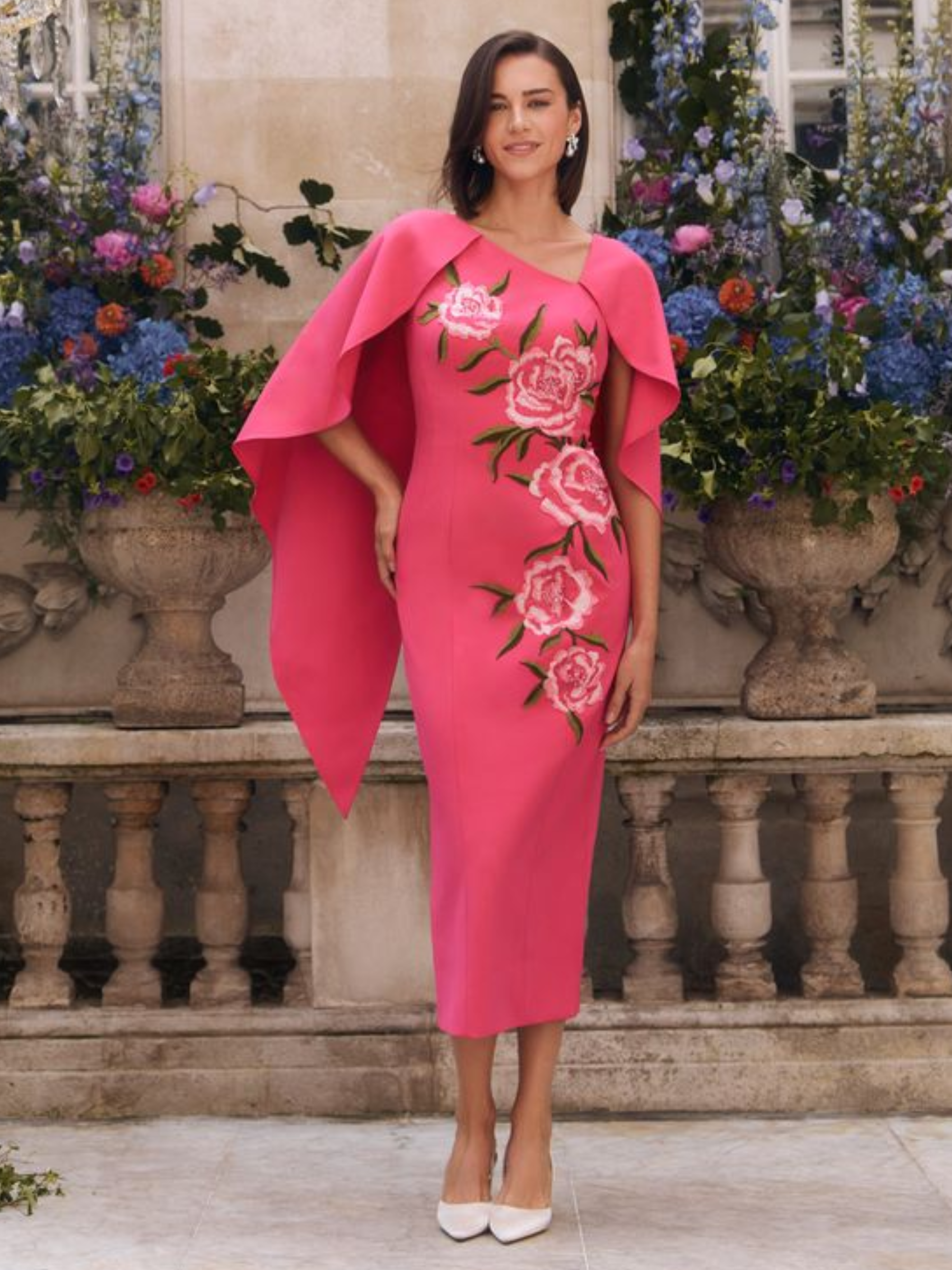 John Charles 66758 Carnation Dress straight midi dress with cape sleeves and floral detailing in vibrant pink.