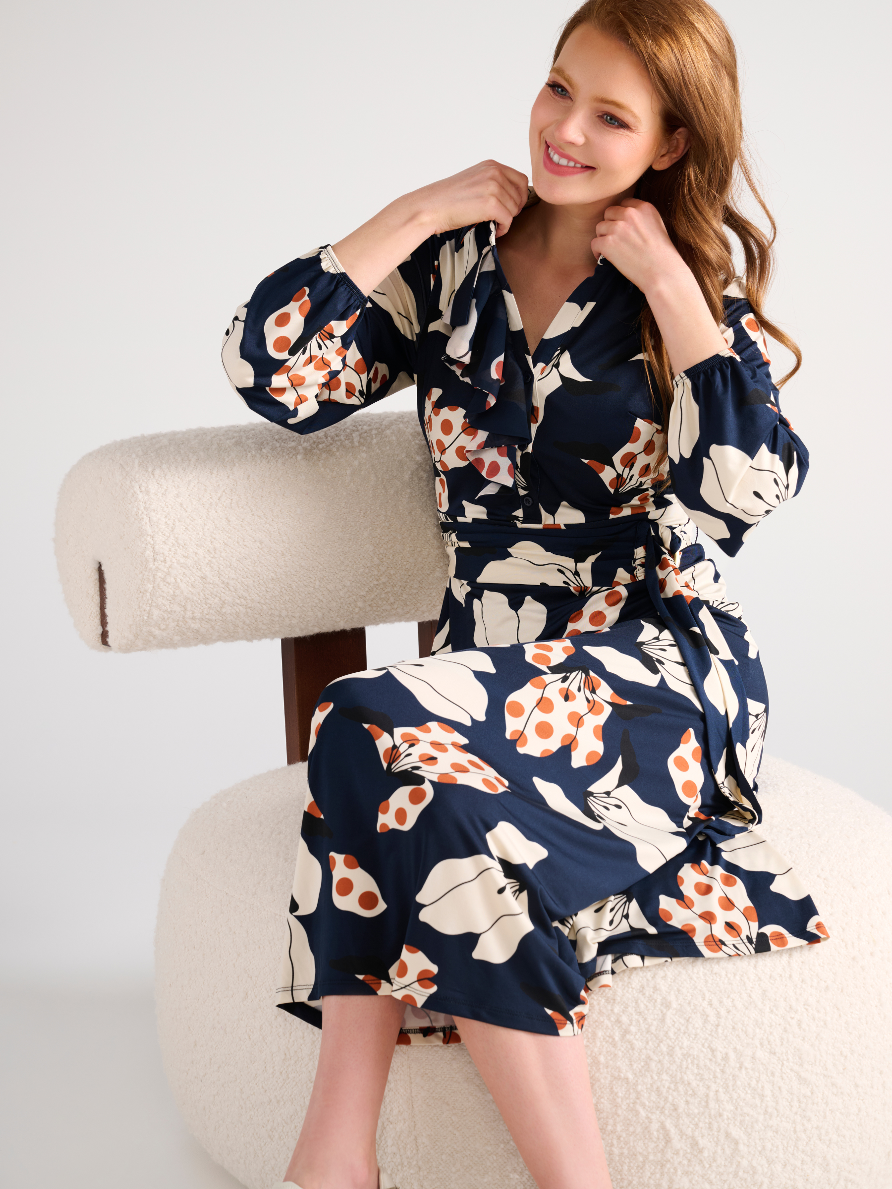 K Design D300 Maxi Dress with bold floral print, collared neckline, front ruffle detail, long sleeves and coordinating waist belt.