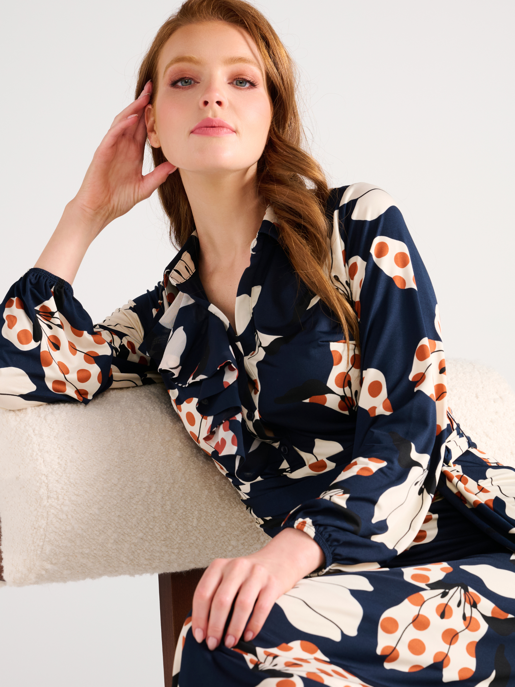K Design D300 Maxi Dress with bold floral print, collared neckline, front ruffle detail, long sleeves and coordinating waist belt.