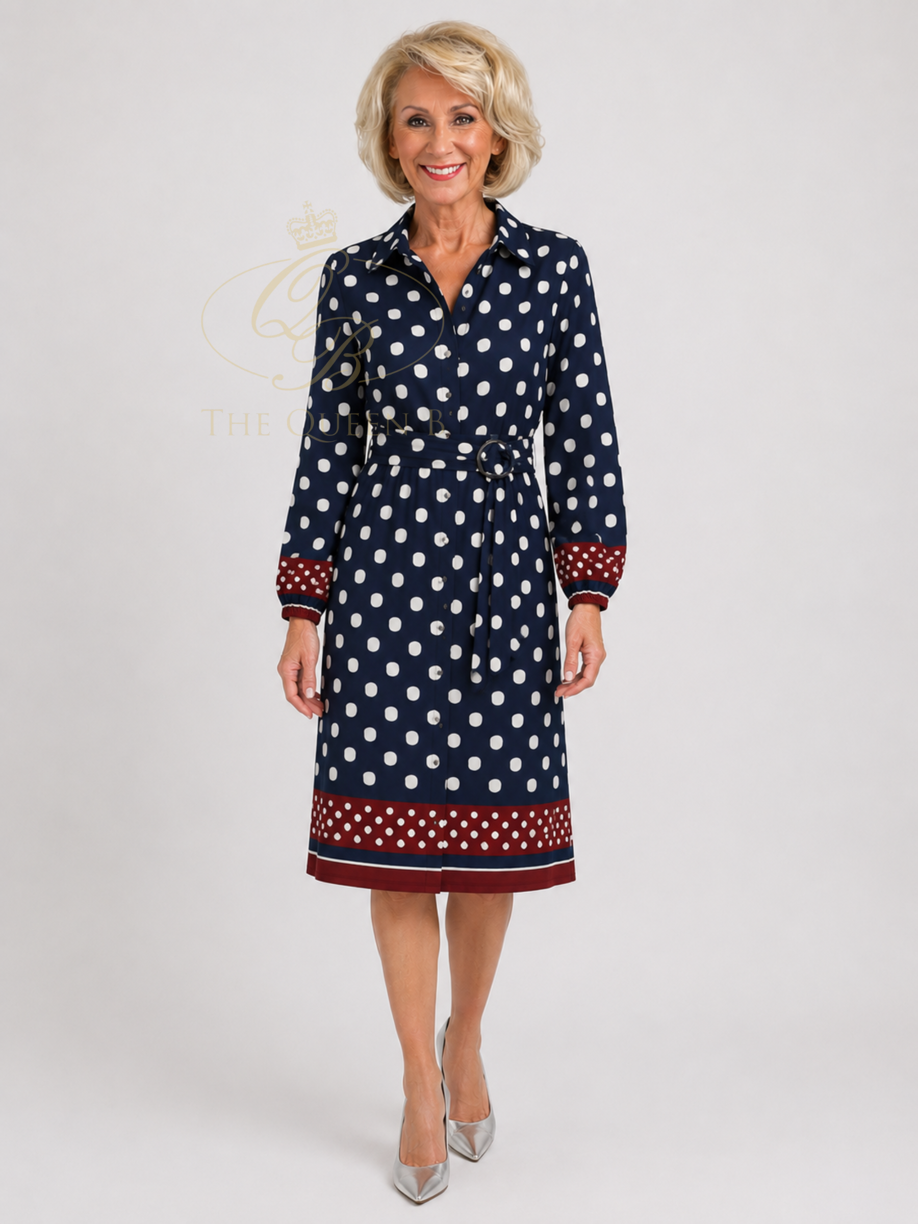K Design D327L Dress with polka dot print, collared neckline, long sleeves, waist belt and contrast border detail.