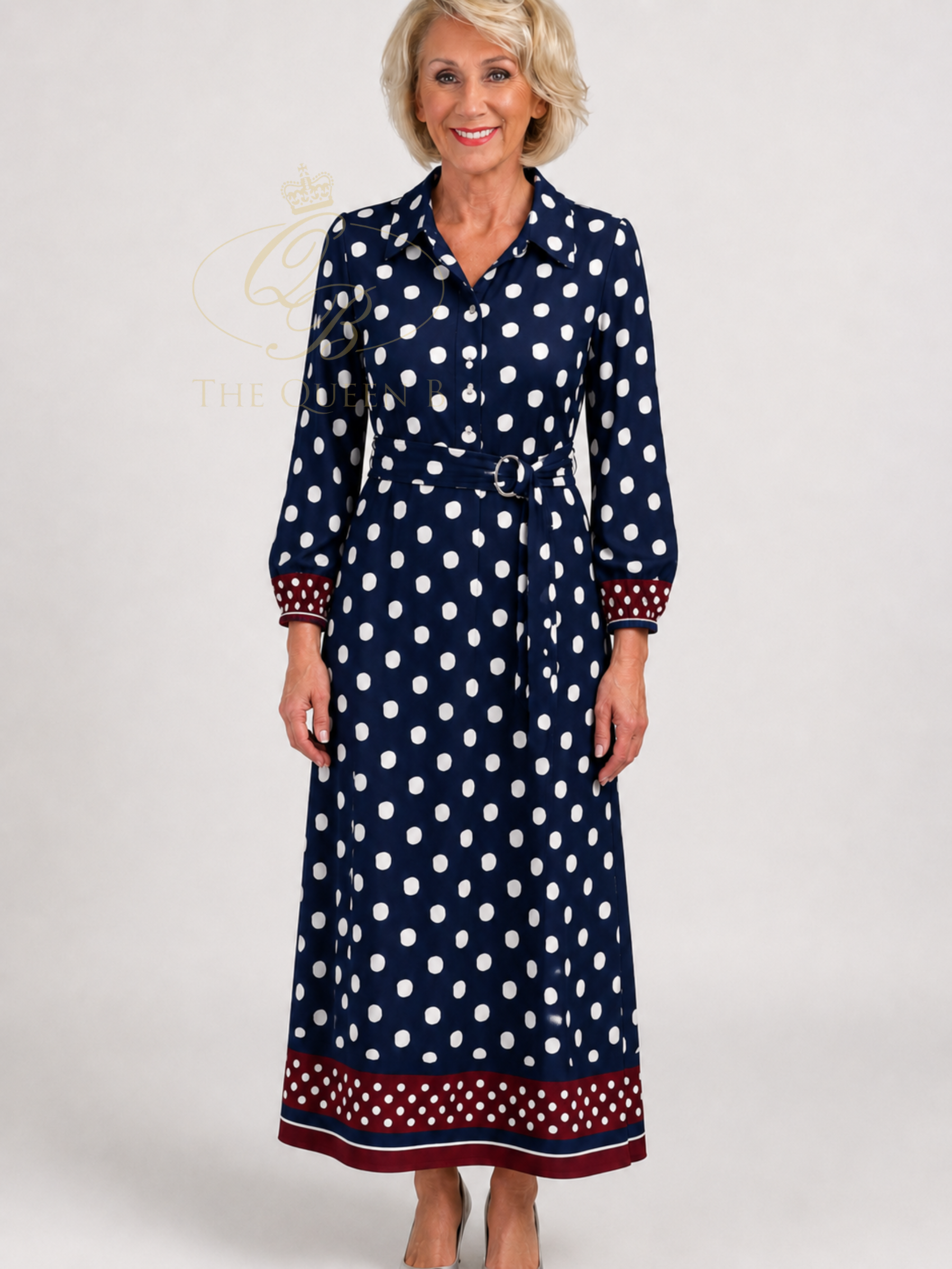 K Design D328L Maxi Dress with spot print, collared neckline, button-through bodice, long sleeves, waist belt and contrast border detail.