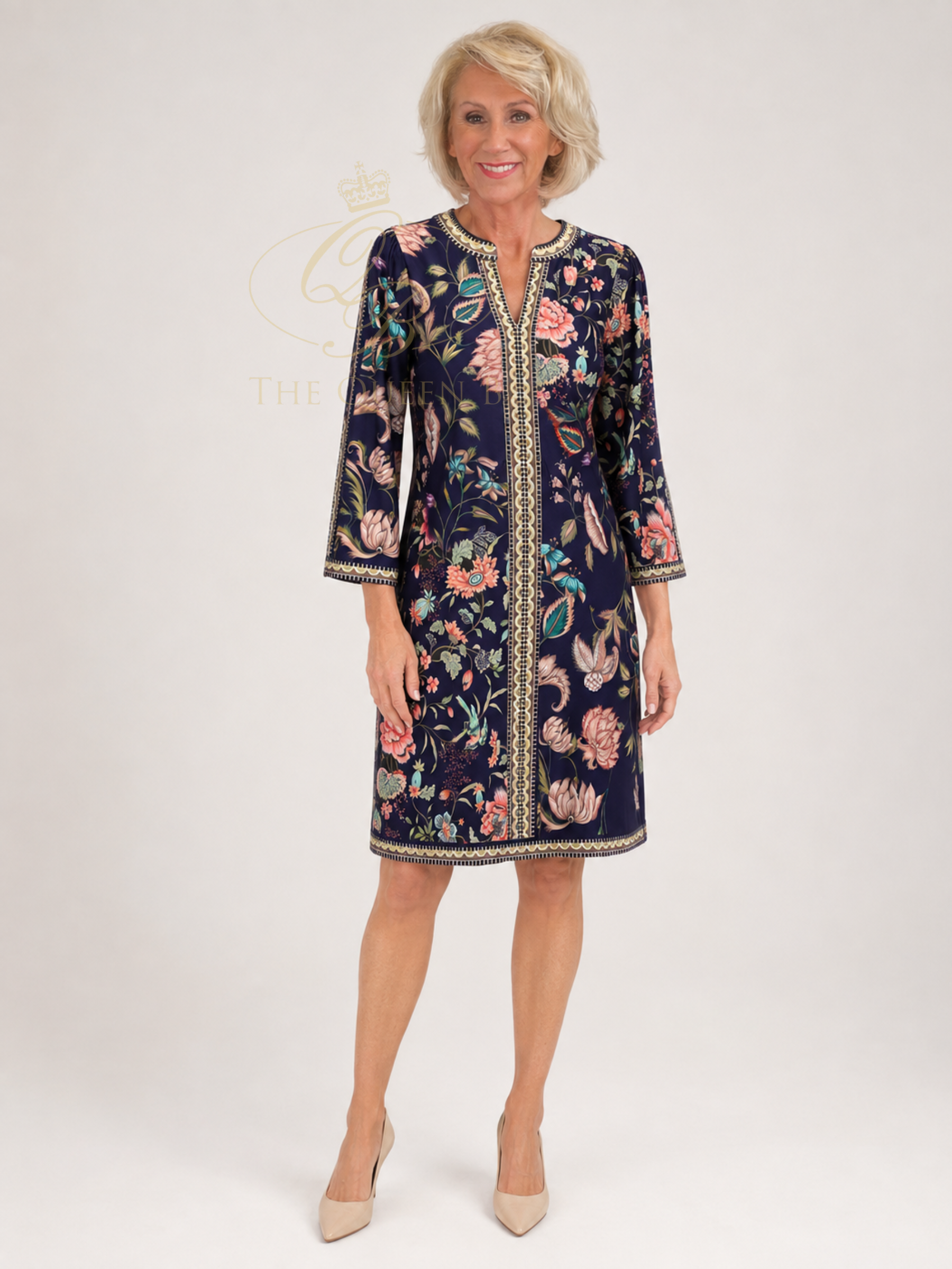 K Design D604 Short Dress with floral print, V-neckline, decorative border detailing and 3/4 sleeves.