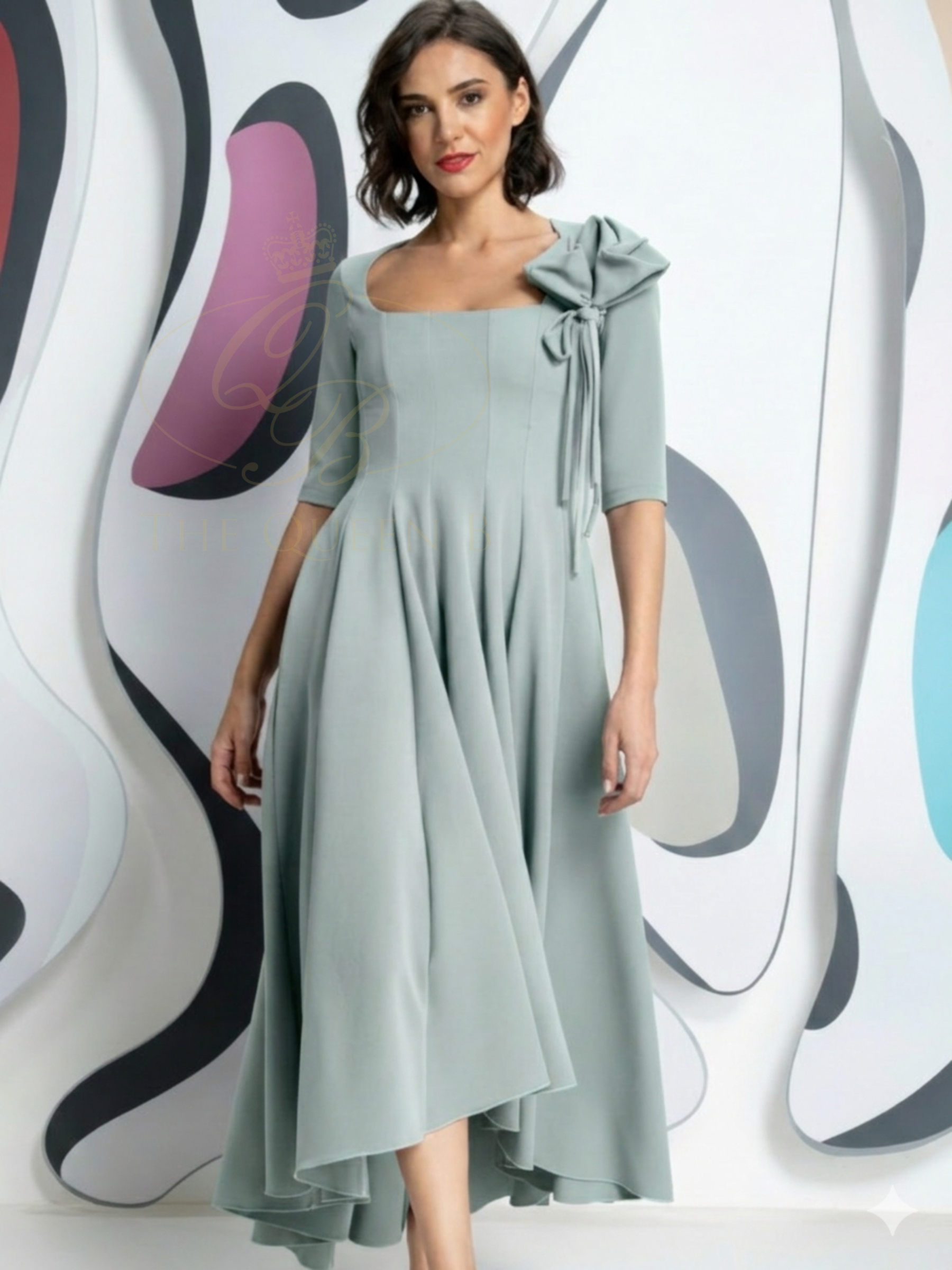 Kevan Jon Diana Dusty Blue Flare Dress in Delauney Scuba with scoop neckline, sculpted bodice and flowing high-low flared skirt.