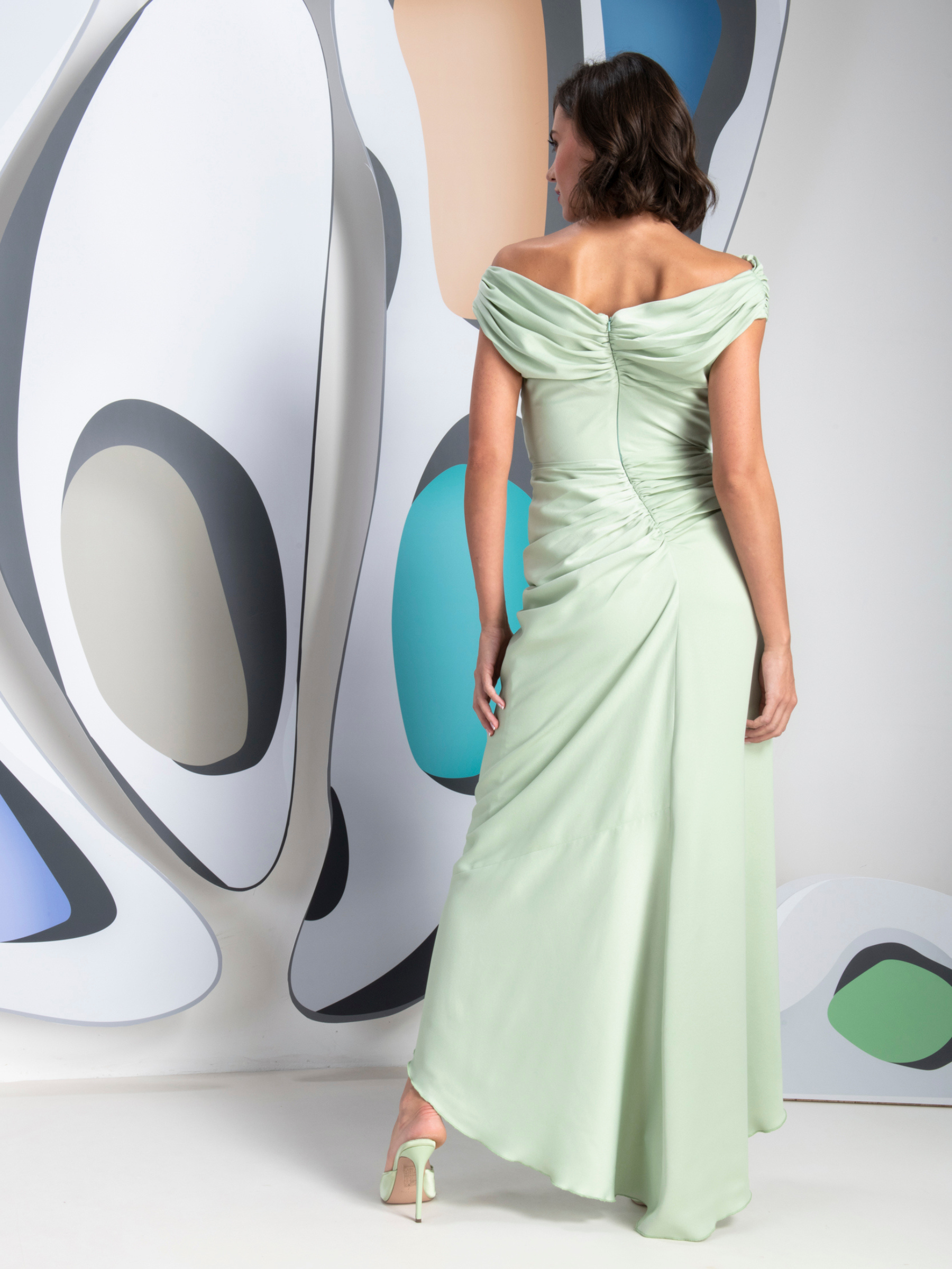 Kevan Jon Eugenia Bardot Asym Mint Dress in satin crepe with bardot draped neckline, ruched drawstring waist and asymmetric waterfall skirt.