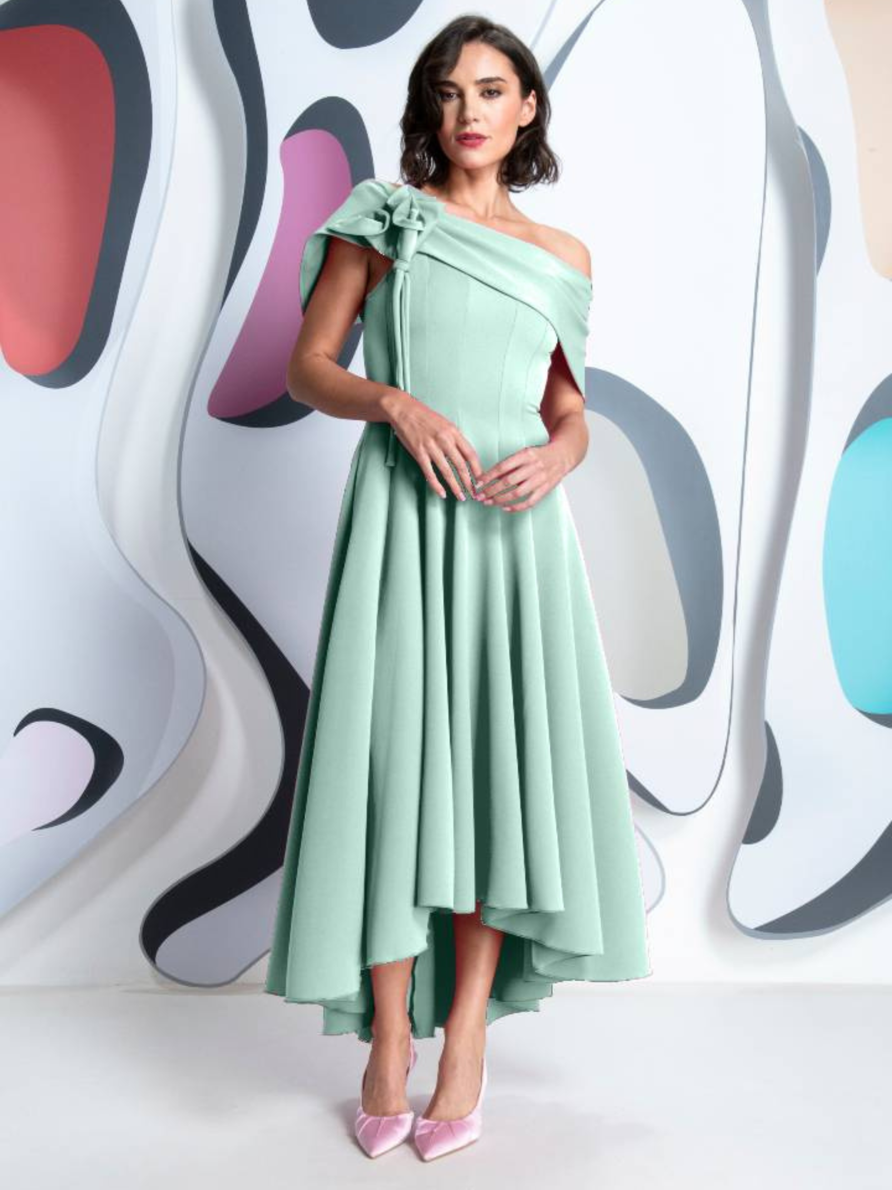 Kevan Jon Kristina Mint Flare Dress in Delauney Scuba with asymmetric off-shoulder neckline, oversized shoulder bow and high-low flared skirt.