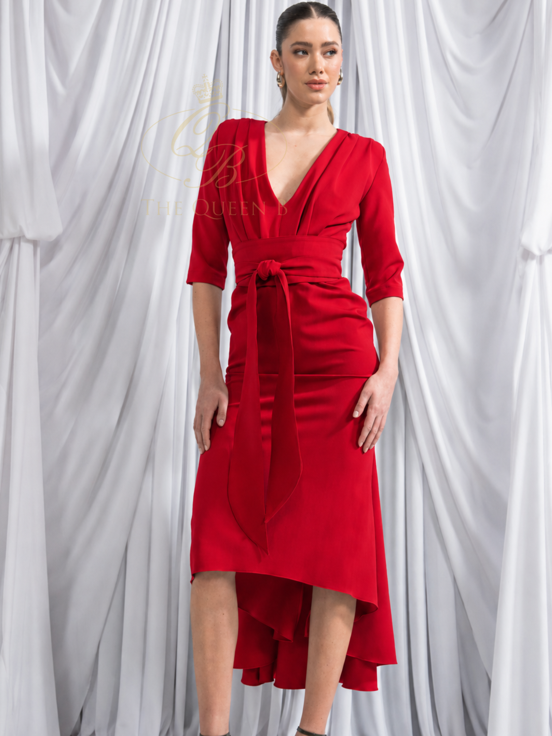 Kevan Jon Lorenza Red Pleat Midi Dress with draped V-neckline, self-tie waist belt and asymmetric midi skirt