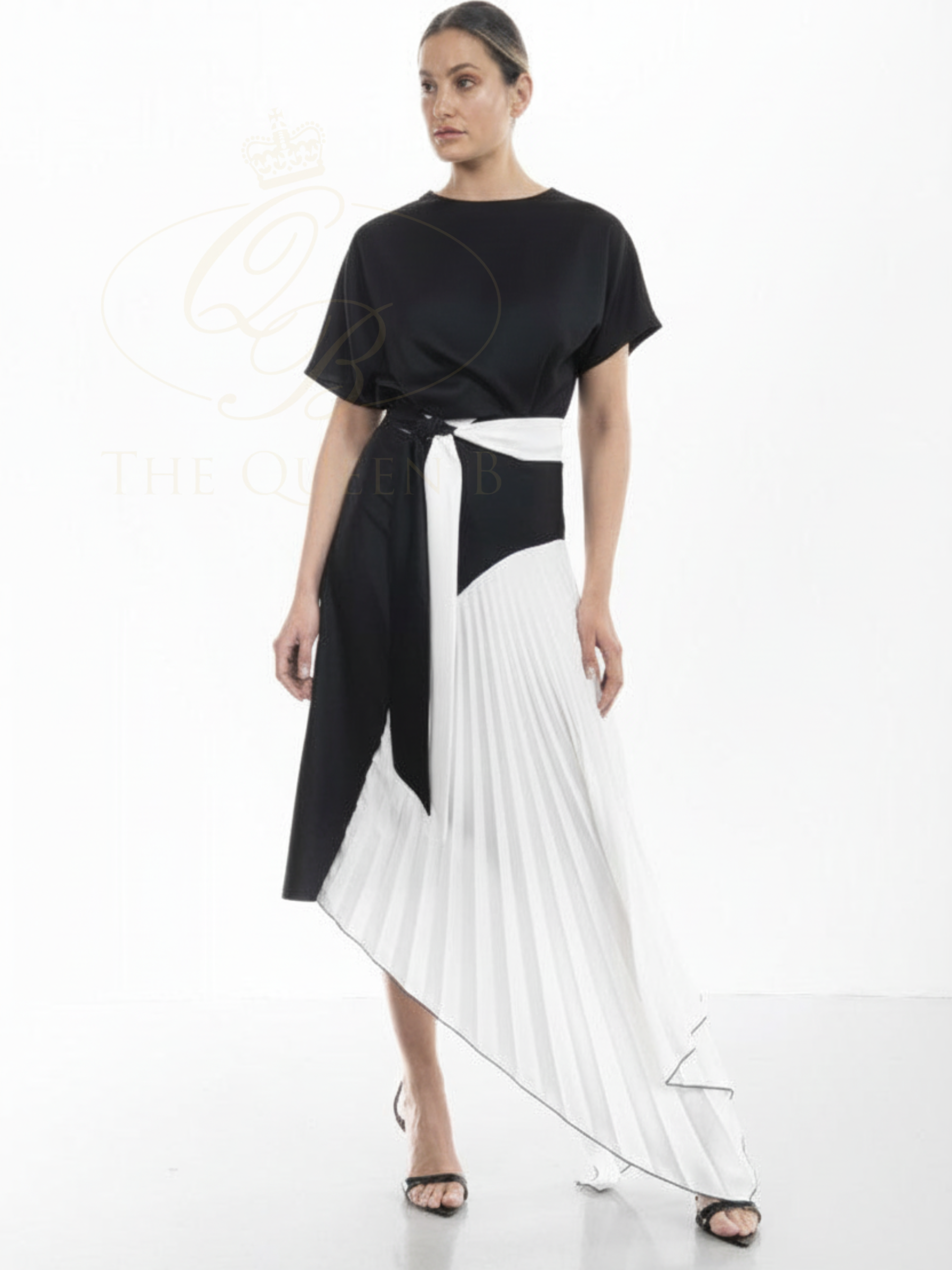 Kevan Jon Mila Pleat Black/White Knee Dress in satin crepe with contrast pleated panel, asymmetrical hem and waist tie detail.