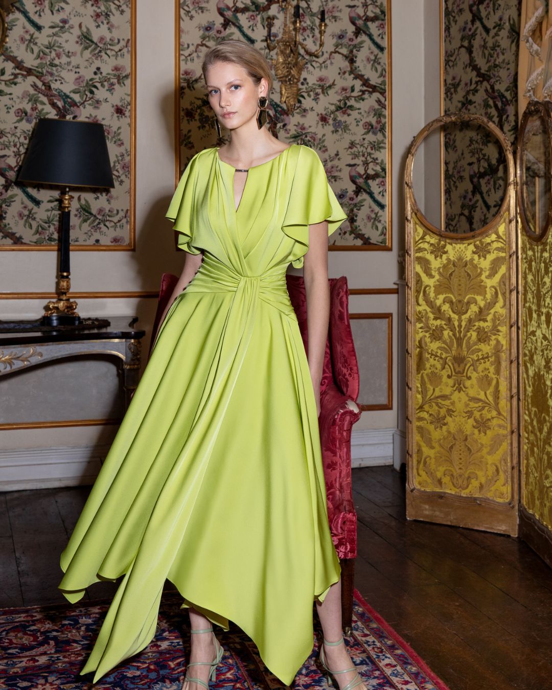 Maisonel ME3003 Lime Dress – women’s satin occasion dress in vibrant lime with flutter sleeves, gathered waist detail, and asymmetric hemline. Perfect for weddings and formal events.
