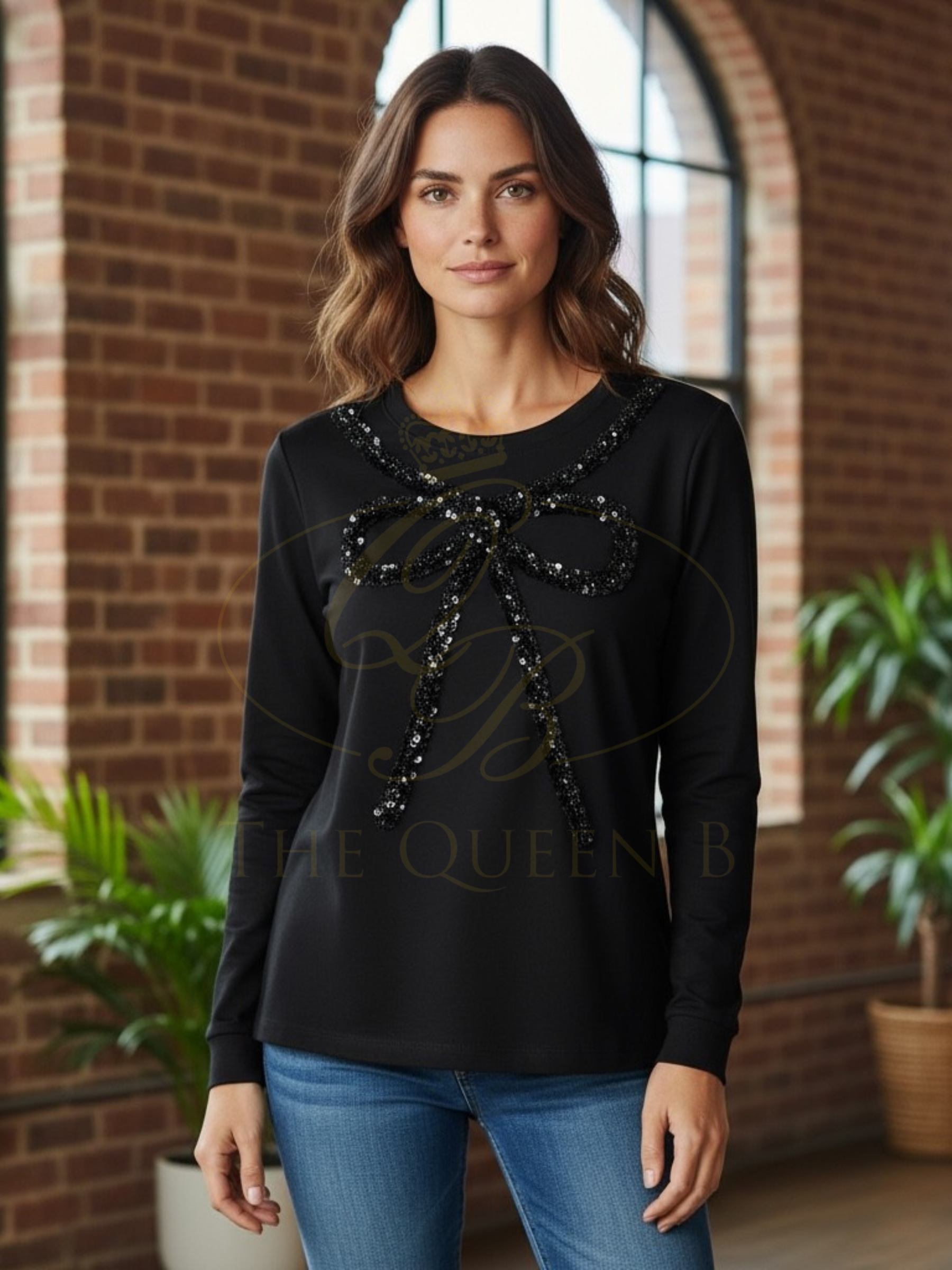 Malissa J WF2503 black sequin bow top—women’s embellished long-sleeve jersey top with statement bow detail.