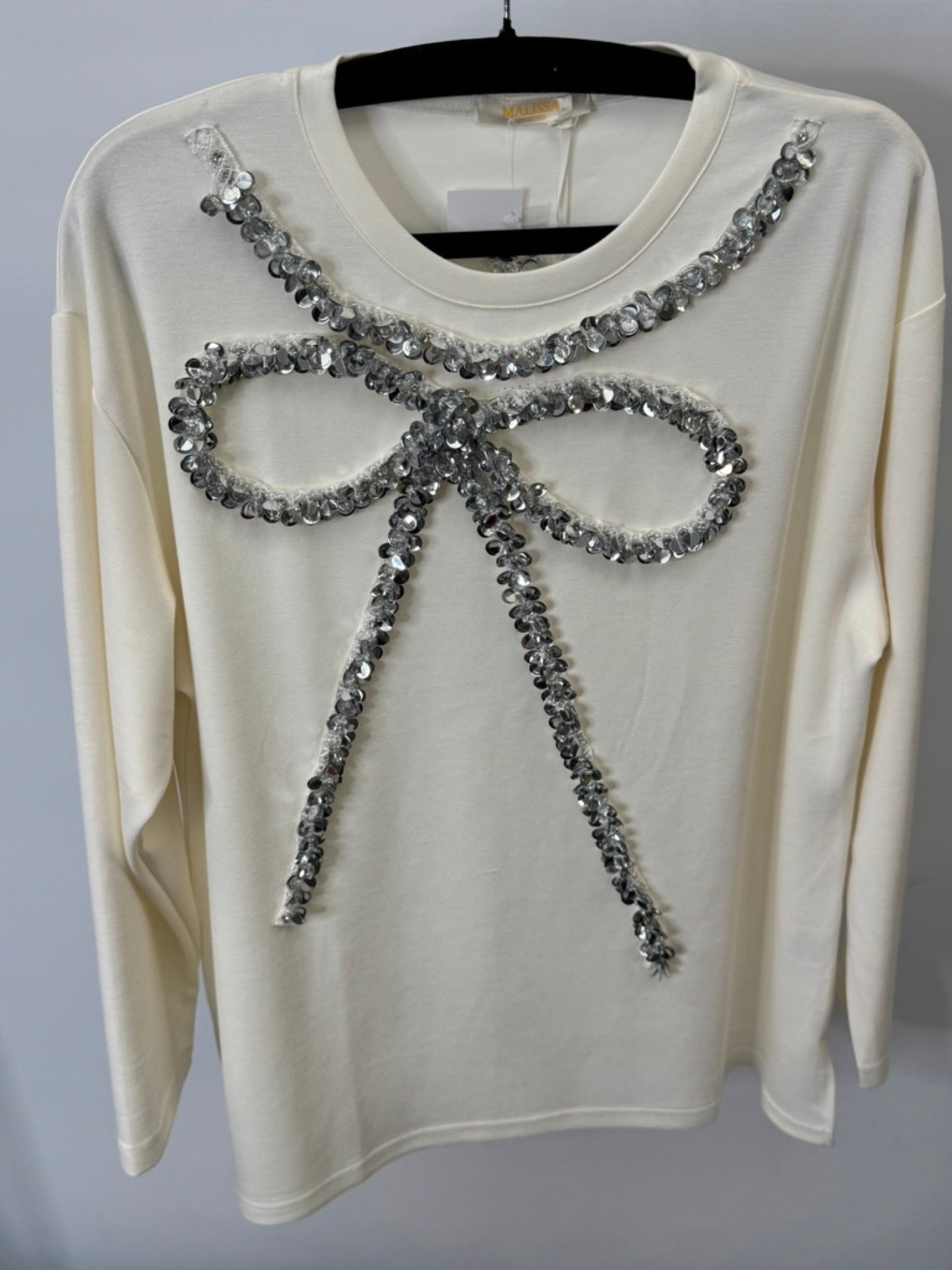 Malissa J WF2503 winter white sequin bow top—women’s embellished long-sleeve jersey top with silver bow detail.