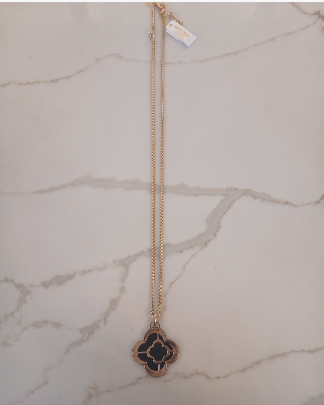 Gold necklace with a clover-shaped pendant 