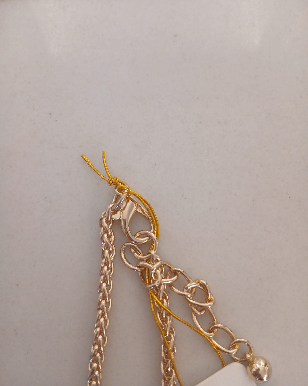 Gold necklace with a clover-shaped pendant 