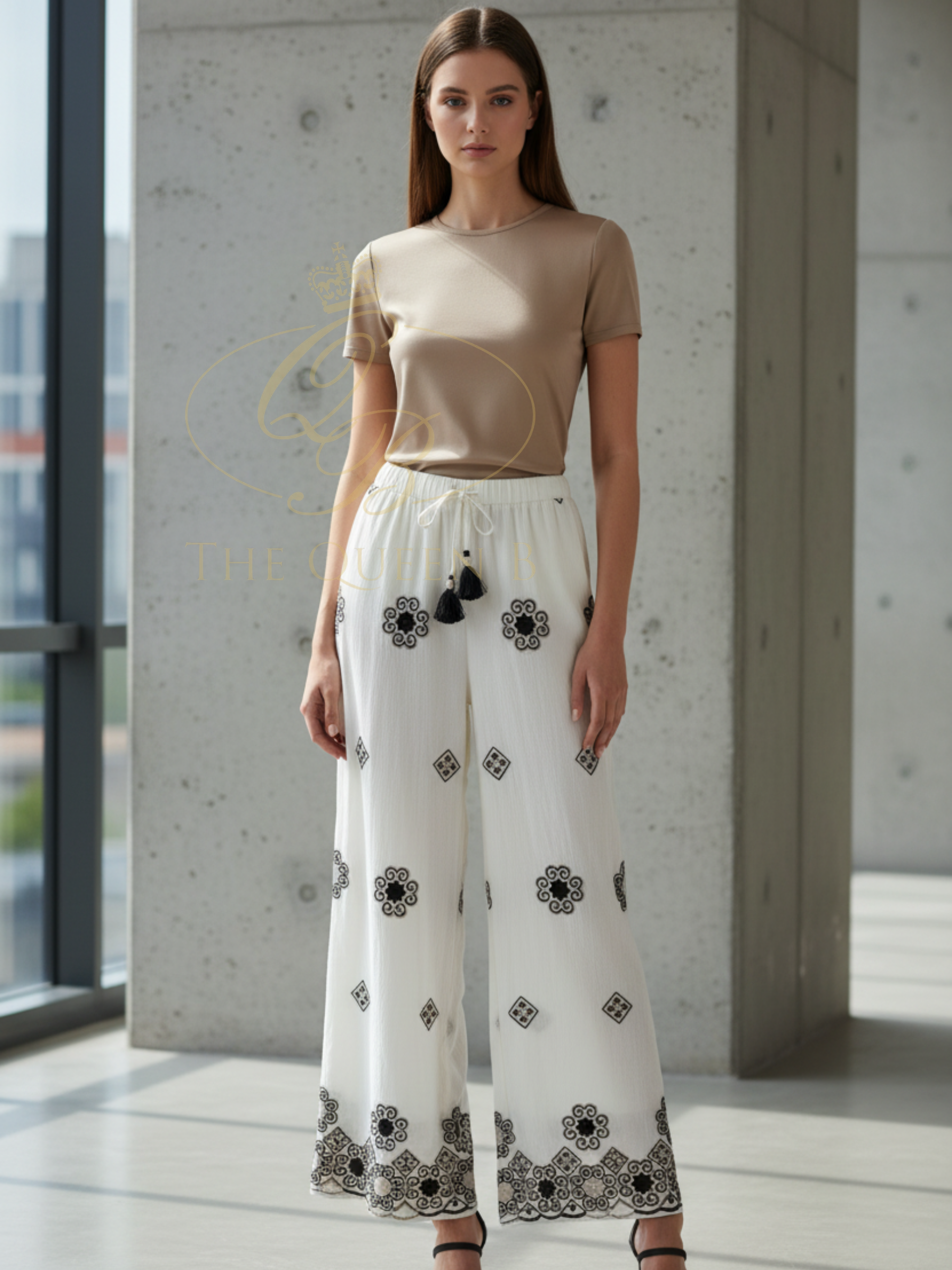Malissa J WF2822 Embroidered Trousers with elasticated waistband, adjustable drawstring and embroidered motif detailing including statement hem finish.