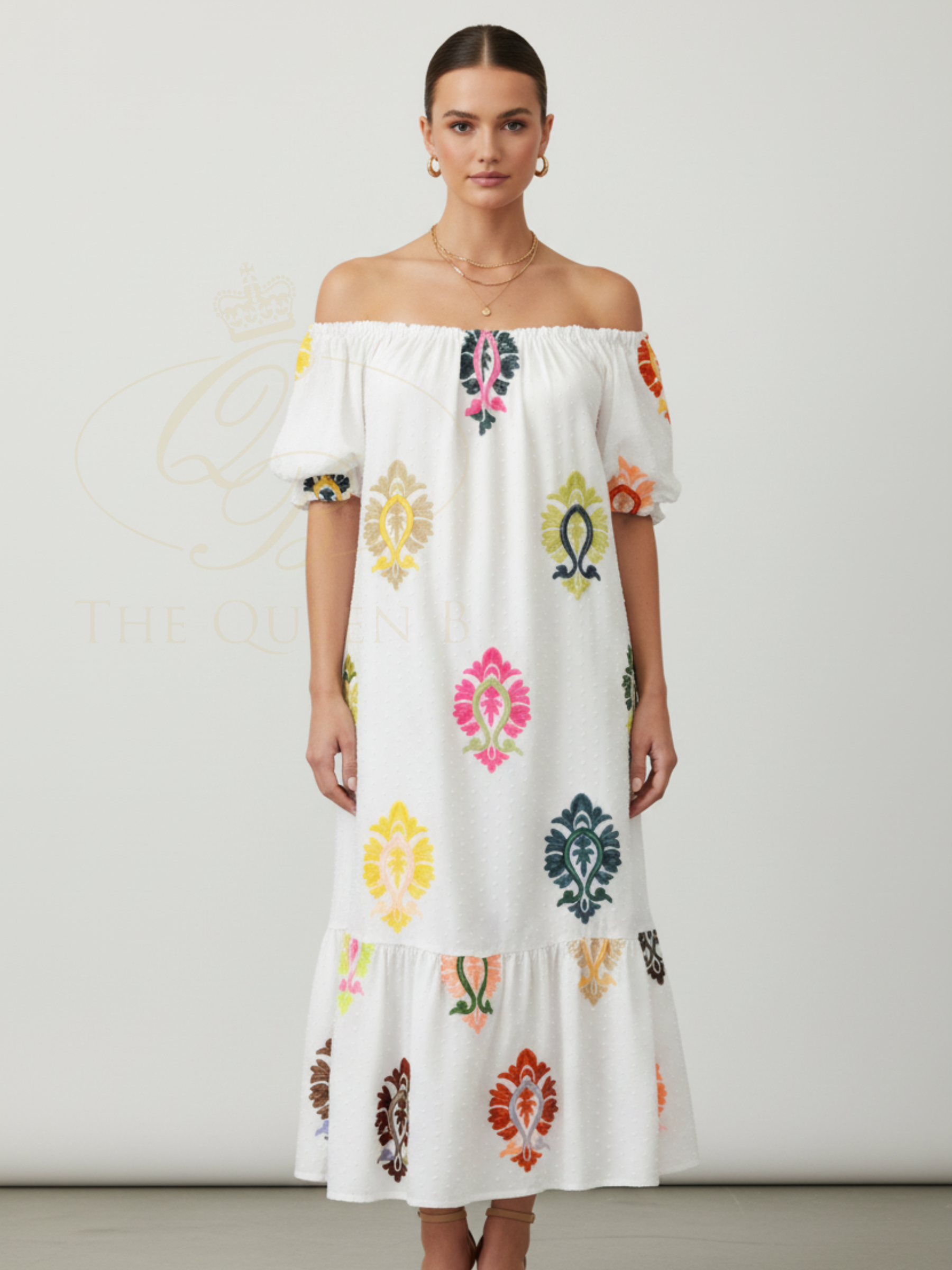 Malissa J WF2836 Embroidered Bardot Style Dress with off-shoulder neckline, short puff sleeves, tiered hem and colourful embroidered motif detailing.