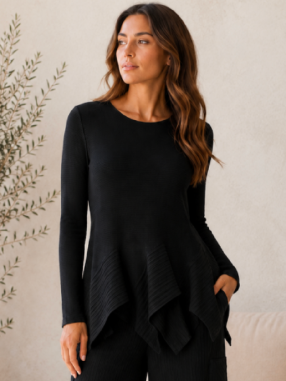 Malissa J WF2918 Pleated Long Sleeve Top with round neckline, pleated texture, long sleeves and asymmetric handkerchief hem.