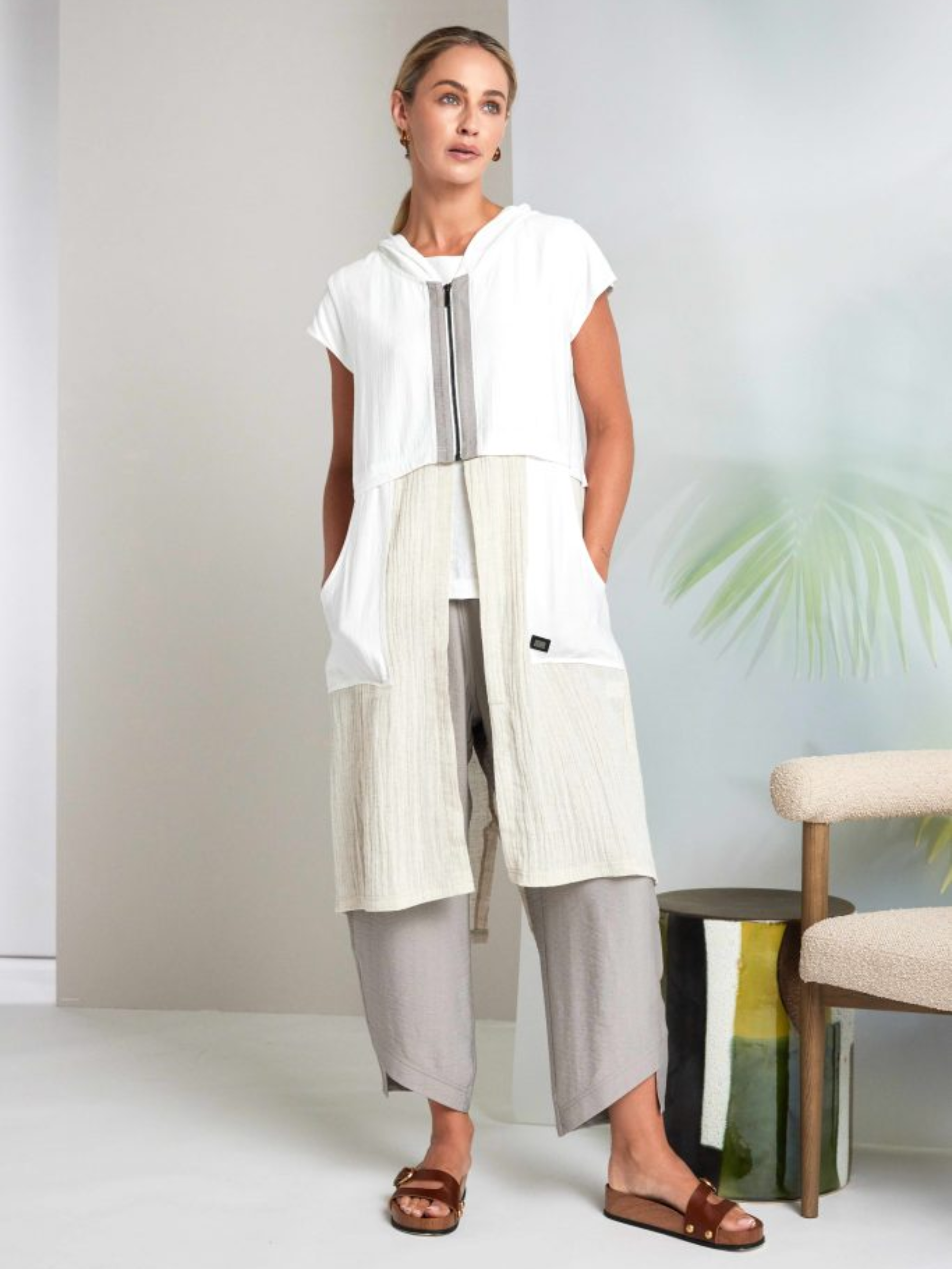 Naya NAS26 157 Hooded Waistcoat featuring sleeveless design, zip-through front, hooded neckline and soft rayon-blend fabric.