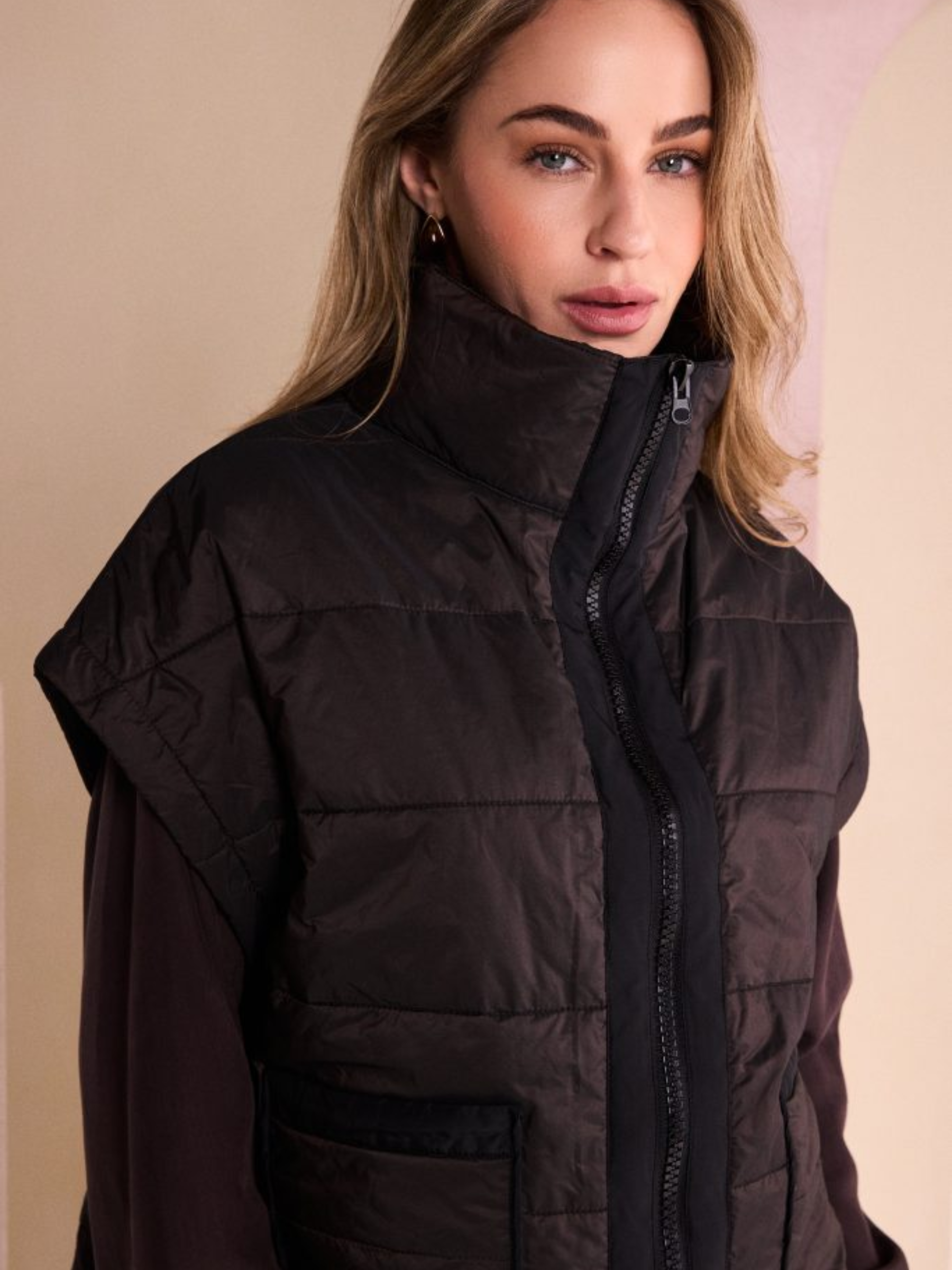 Naya NAW26 167 Padded Short Waistcoat with high neckline, zip front, patch pockets and sleeveless padded finish
