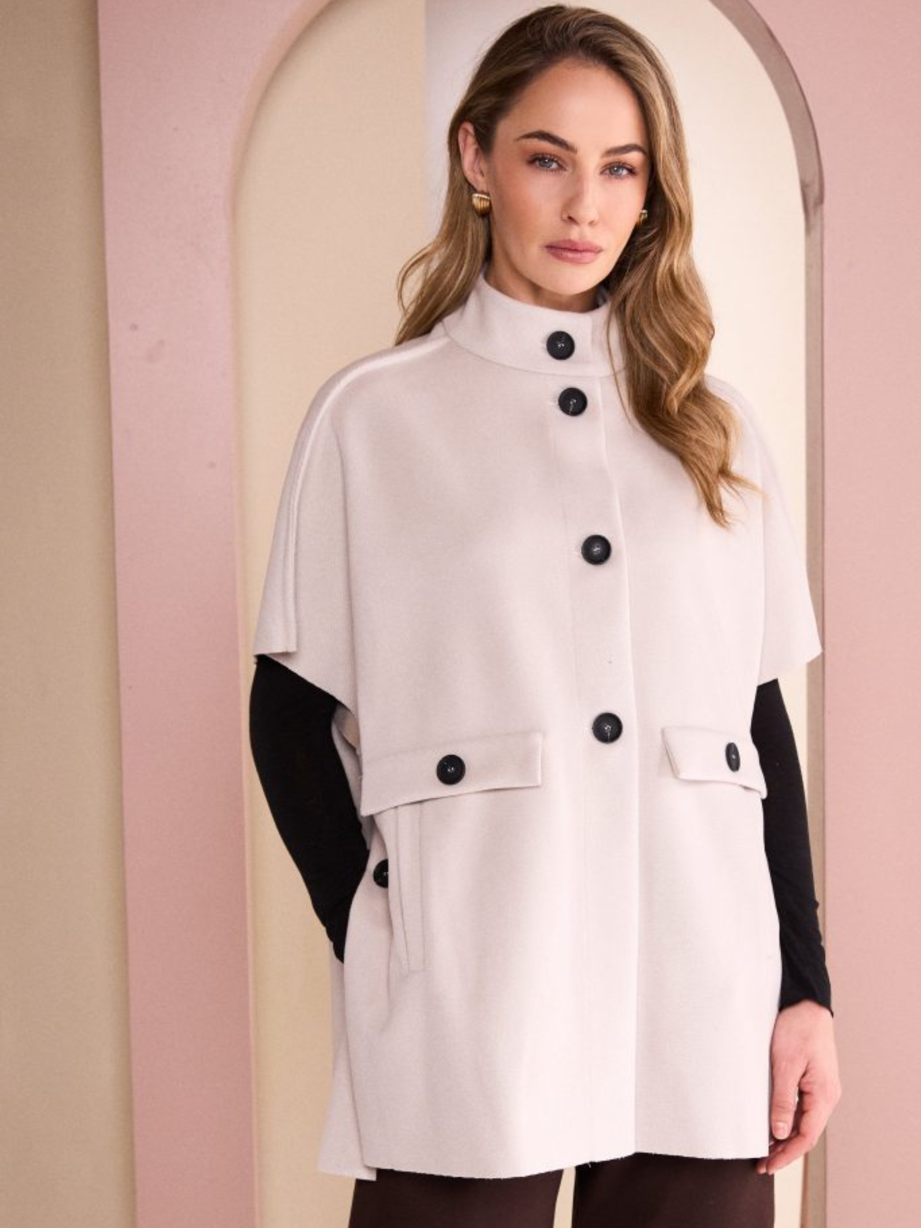Naya NAW26 293 High Neck Button Through Jacket with high neckline, button fastening, cape sleeves and flap pockets