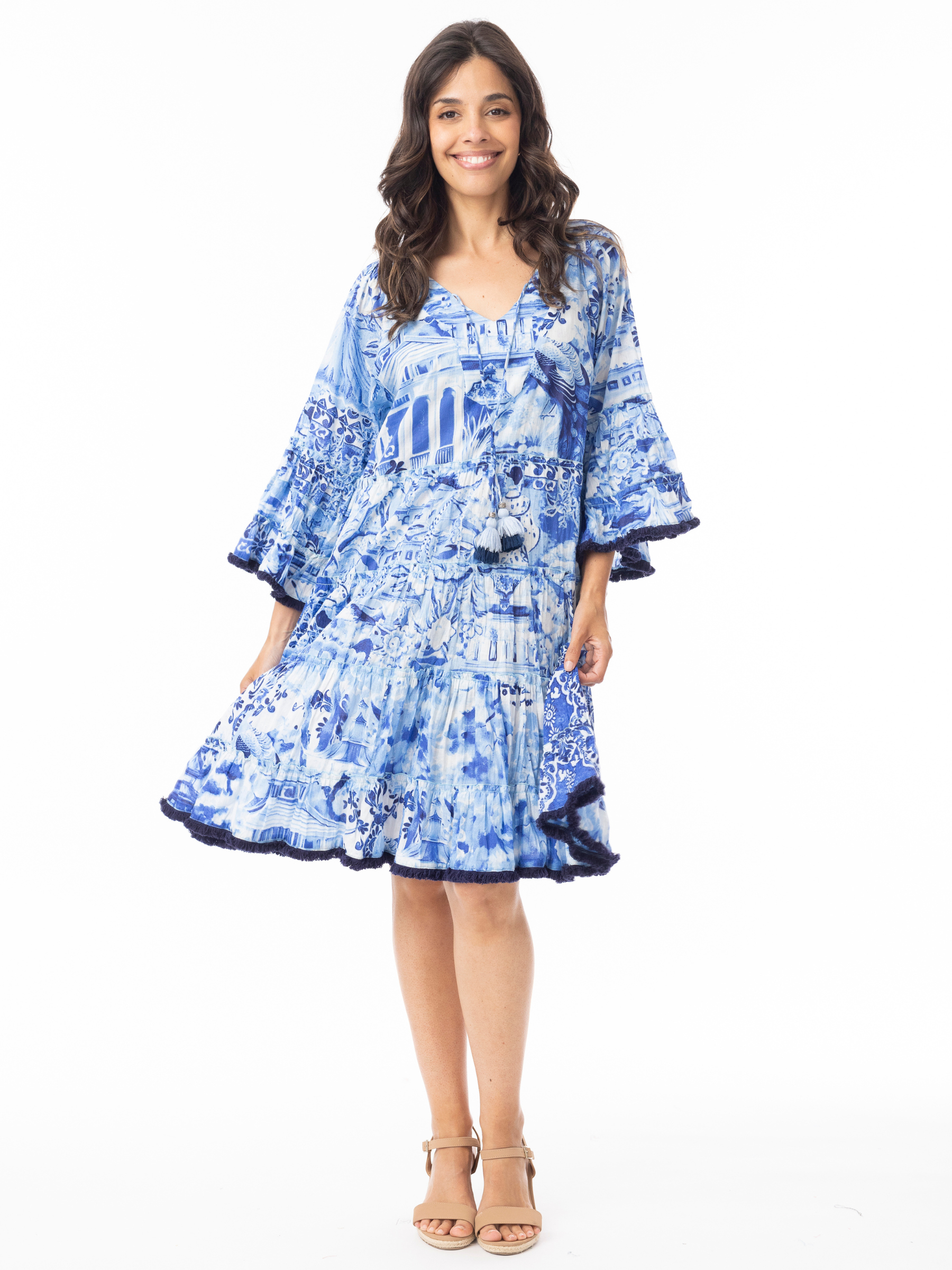 Orientique 40188 Okayama Dress printed tiered dress with V-neckline, tassel tie detail and wide sleeves.