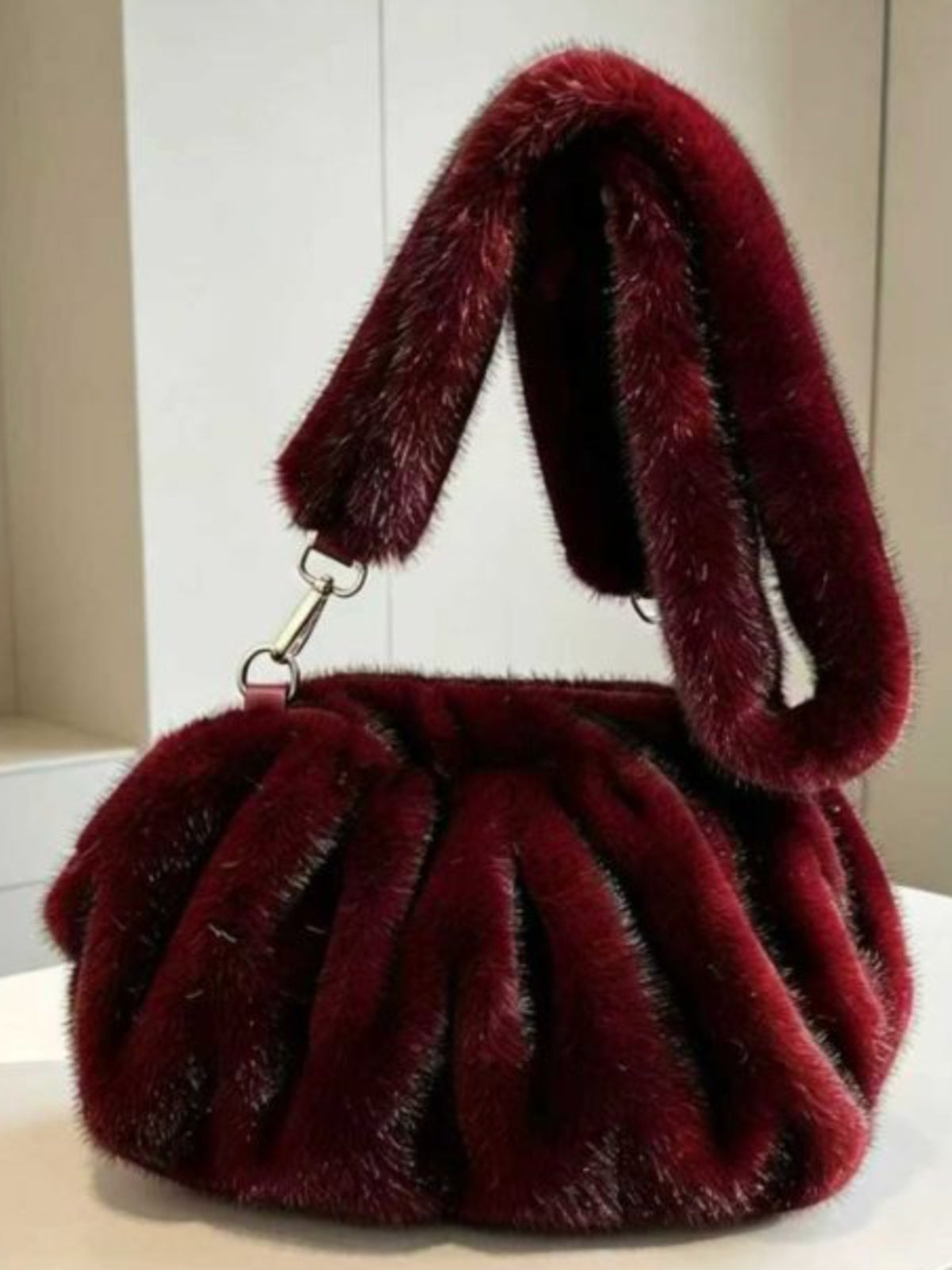 PCHA 60402 Faux Fur Ruched Handbag with gathered design, plush textured finish and matching shoulder strap.