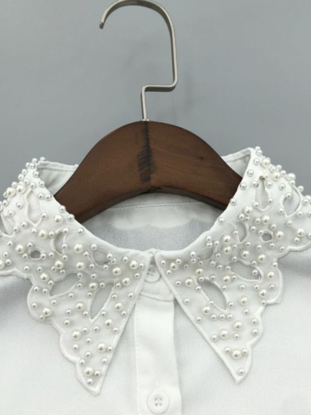 PCHA 7721 Vintage Inspired Pearly Faux Collar with scalloped pointed collar, pearly embellishment and button-front detail.