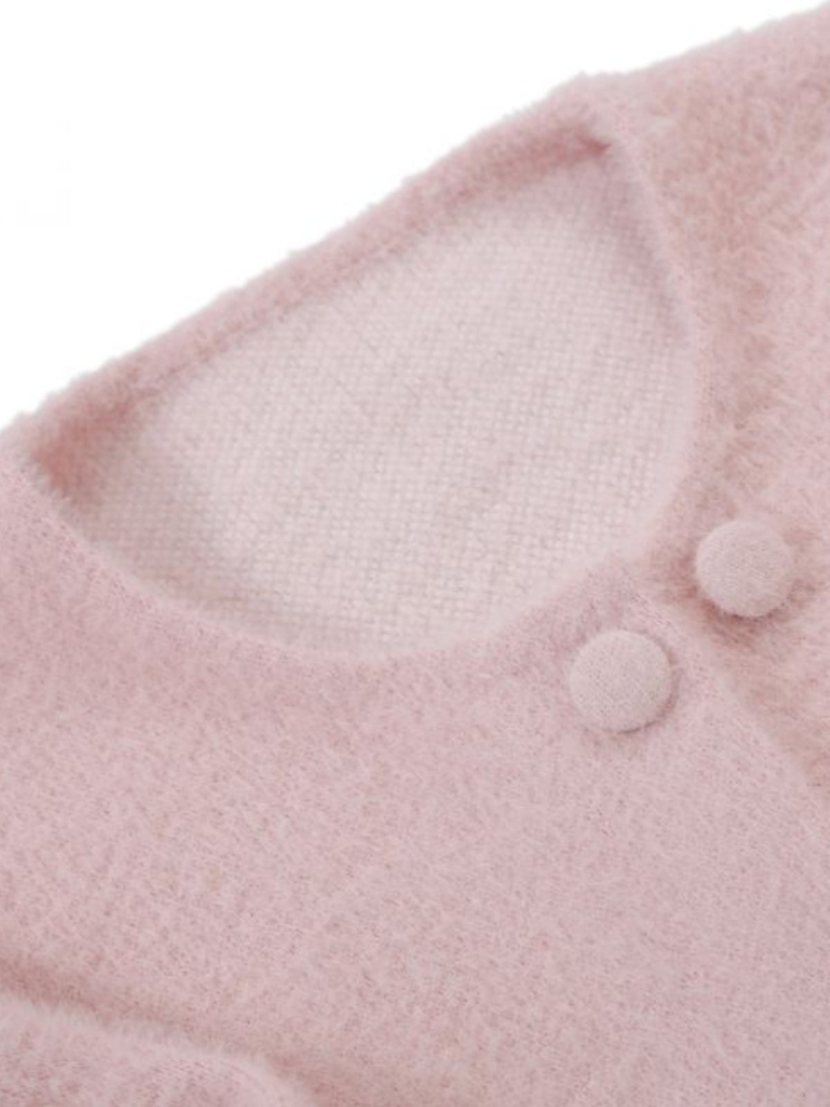 PCHA CA196 Feather Trim Cardigan with round neckline, button front and statement feather trim at the cuffs and hem.