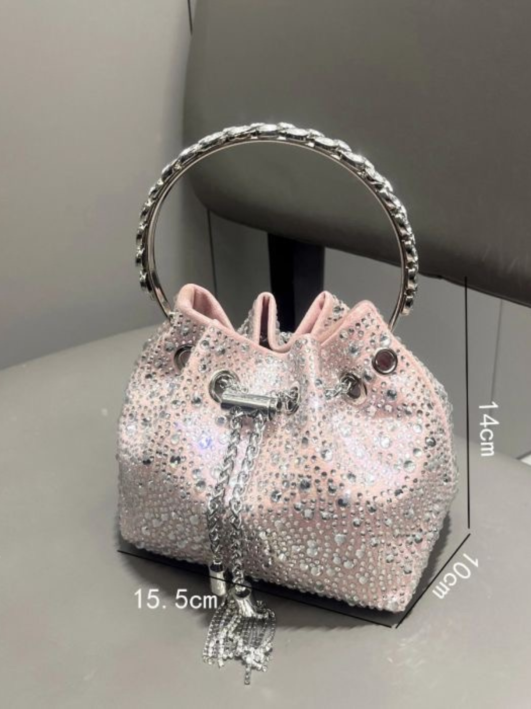PCHA G1142 Pink Pouch Bag featuring sparkling rhinestone embellishments, silver handle, chain tassel detail and a glamorous drawstring design perfect for evening occasions.