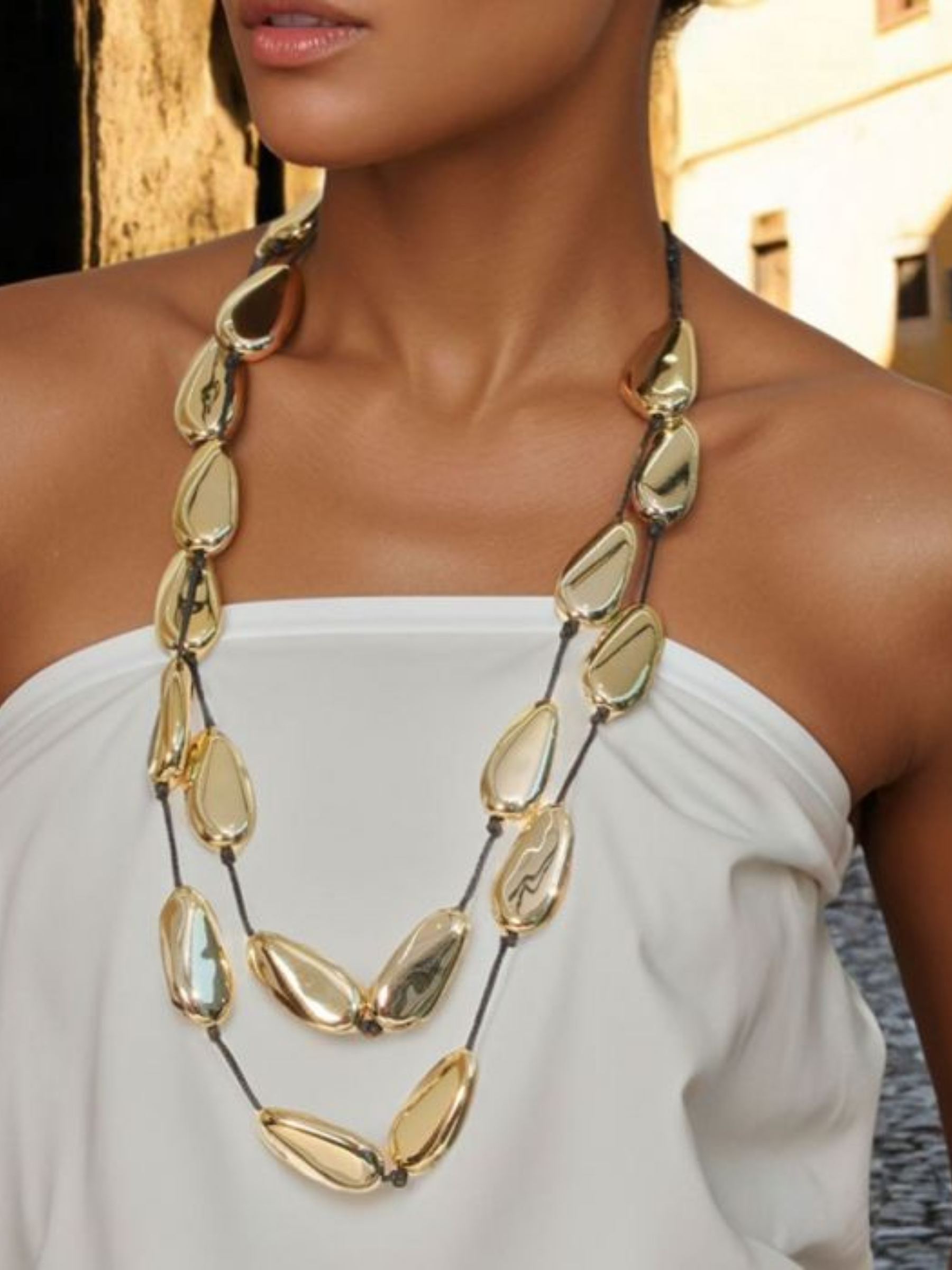 PCHA NEK568 Statement Necklace with longline gold-tone teardrop and pebble pendants on a sleek cord, a bold high-shine accessory perfect for elevating chic or occasion outfits.