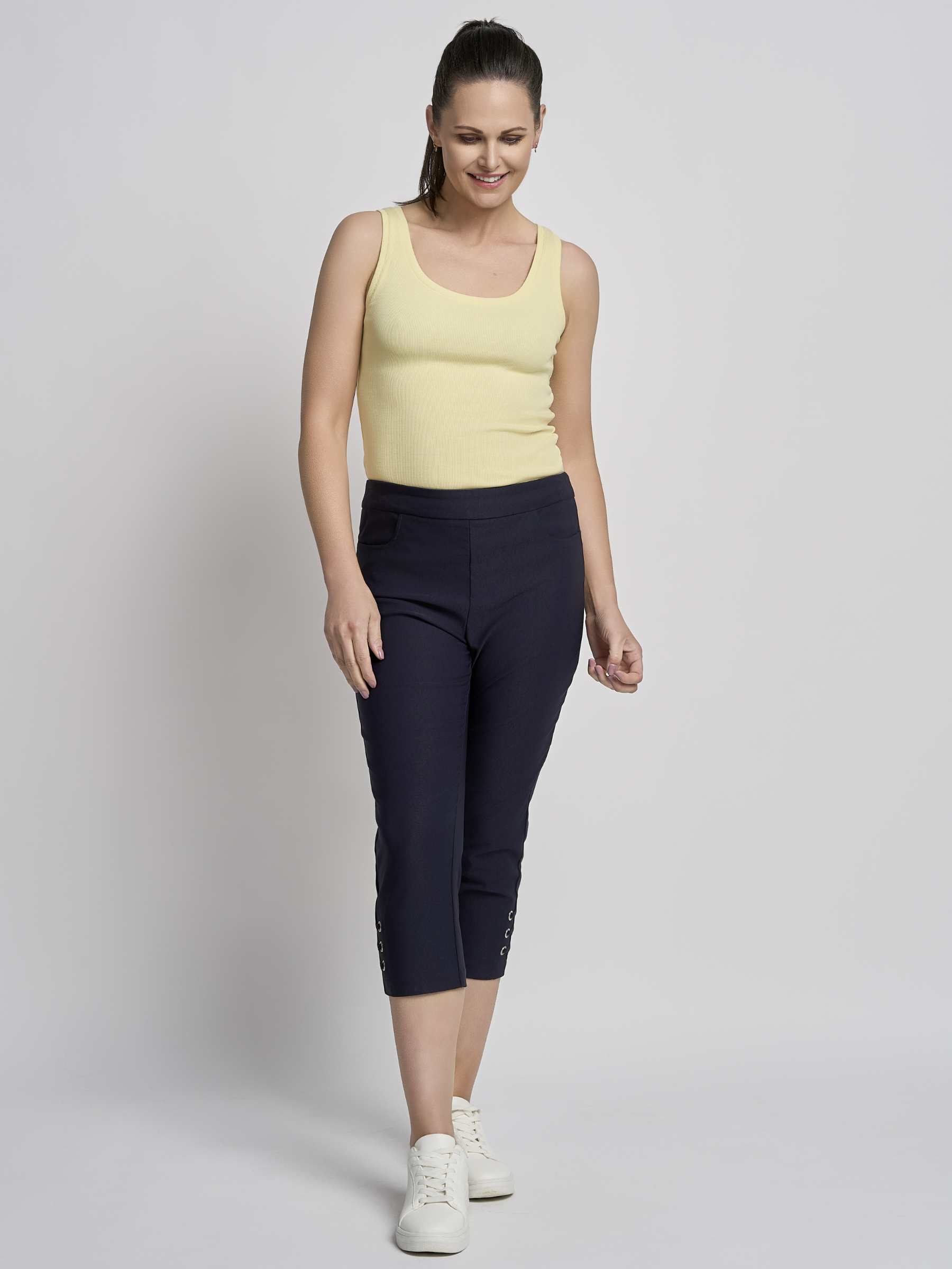 PINNS 408C navy women’s sculpting bengaline crop trousers with hidden tummy control and diamond eyelet hem.