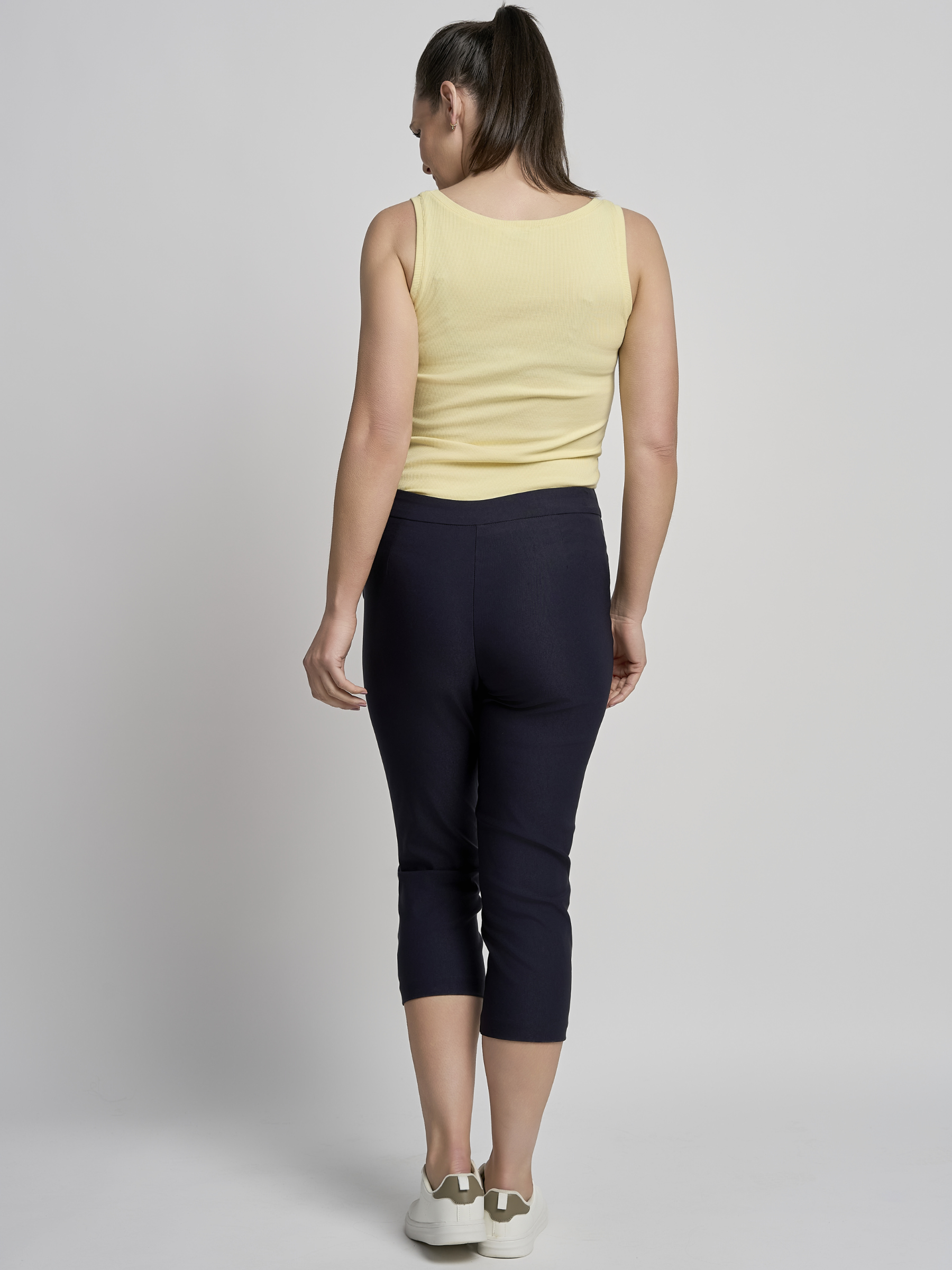 PINNS 408C navy women’s sculpting bengaline crop trousers with hidden tummy control and diamond eyelet hem.
