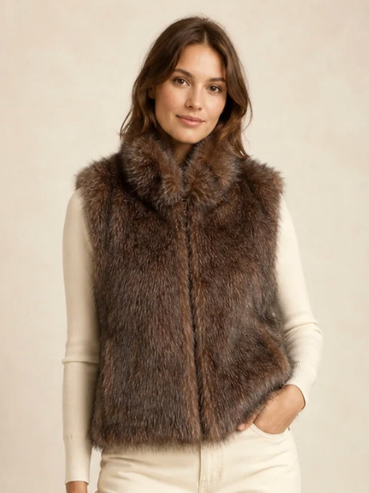 QBAW26 CW Darcy Faux Fur Short Gilet with soft textured finish, sleeveless design, high neckline and pockets.