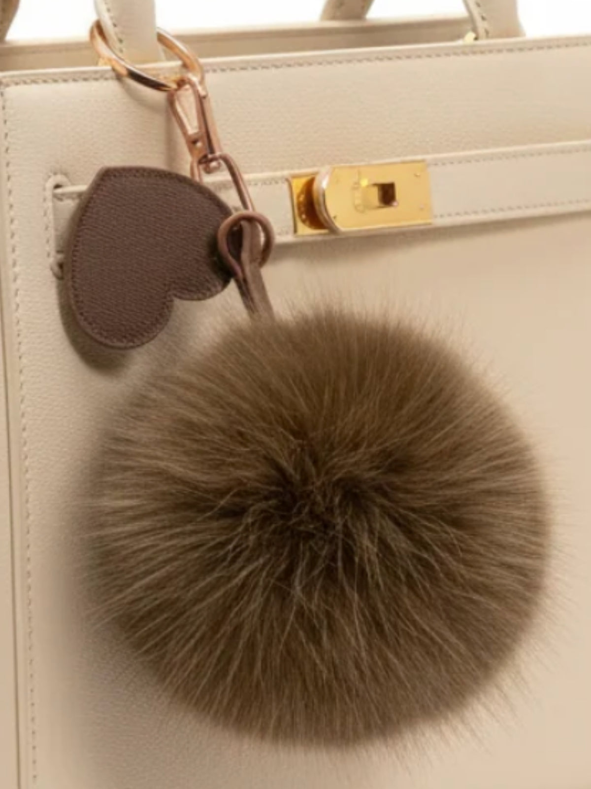 QBAW26 CW Emma Pom Pom Key Chain with soft fluffy pom pom and loop attachment.