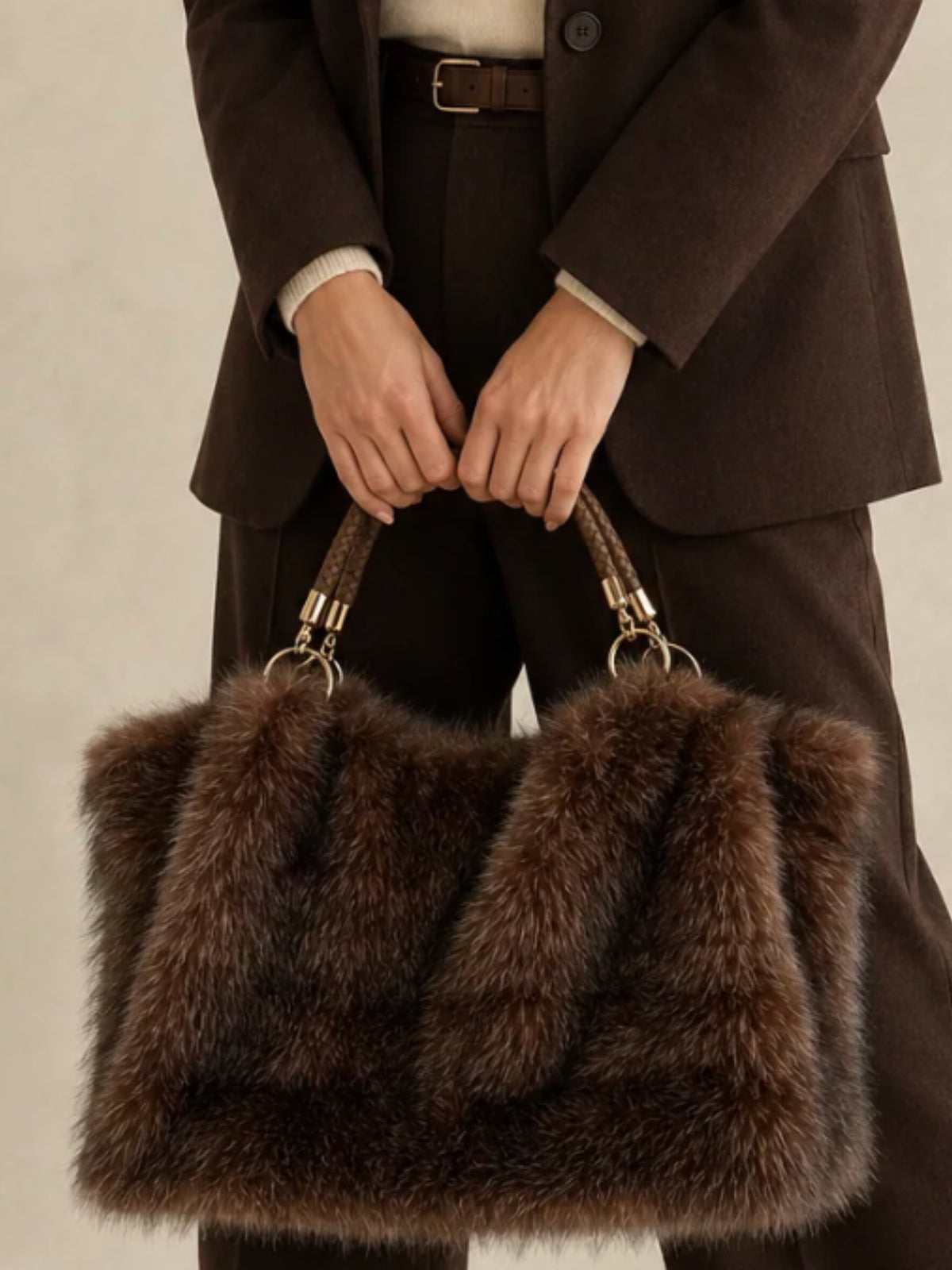 QBAW26 CW Grace Faux Fur Tote Bag with plush textured finish, structured shape, braided top handle and decorative hardware.