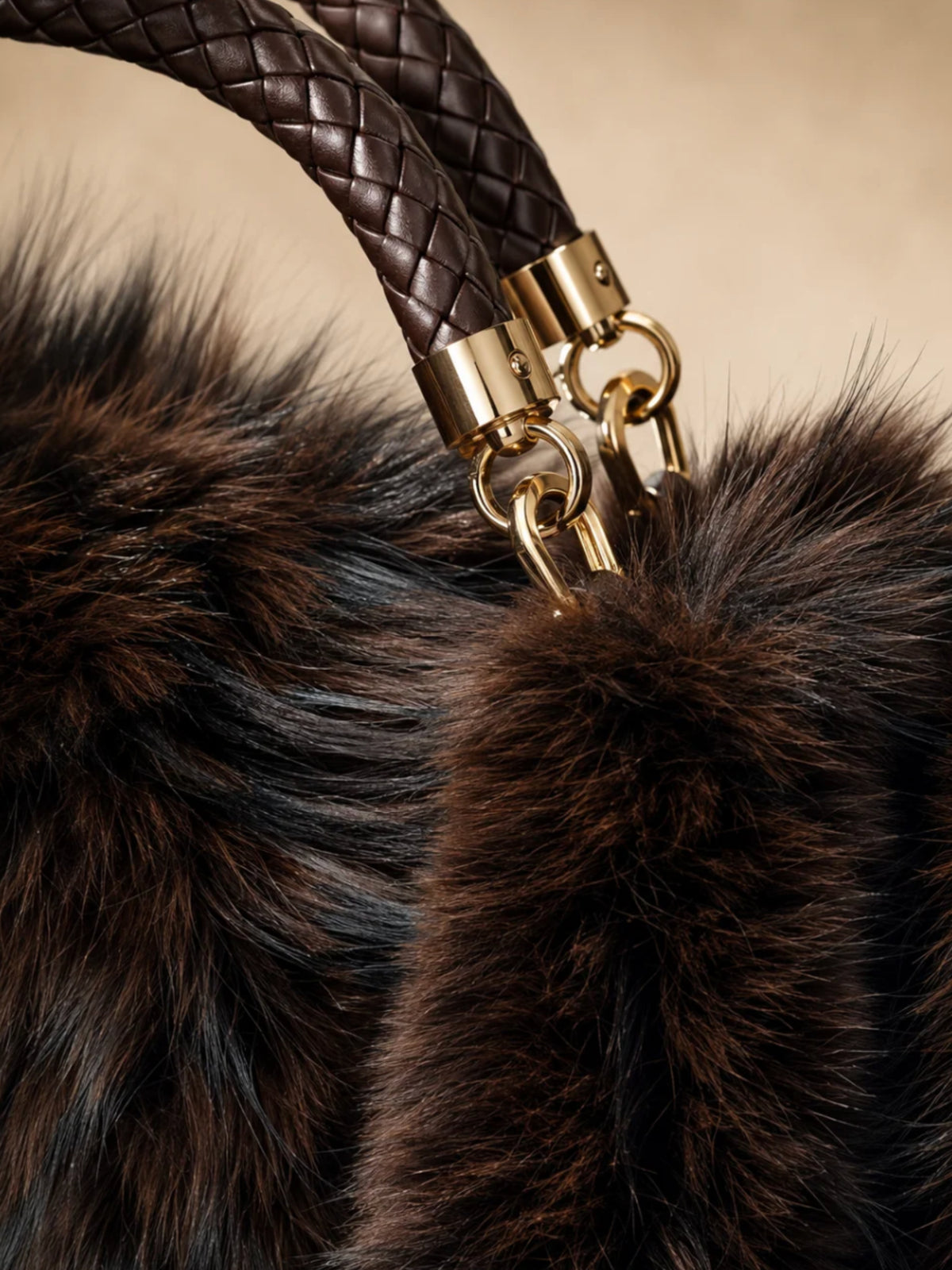 QBAW26 CW Grace Faux Fur Tote Bag with plush textured finish, structured shape, braided top handle and decorative hardware.