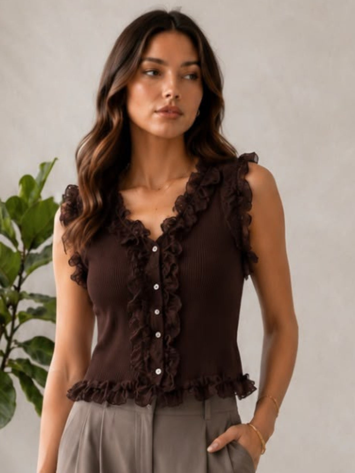 QBAW26 LX Lex Top with V-neckline, button front and ruffle detailing around the neckline, armholes and hem.